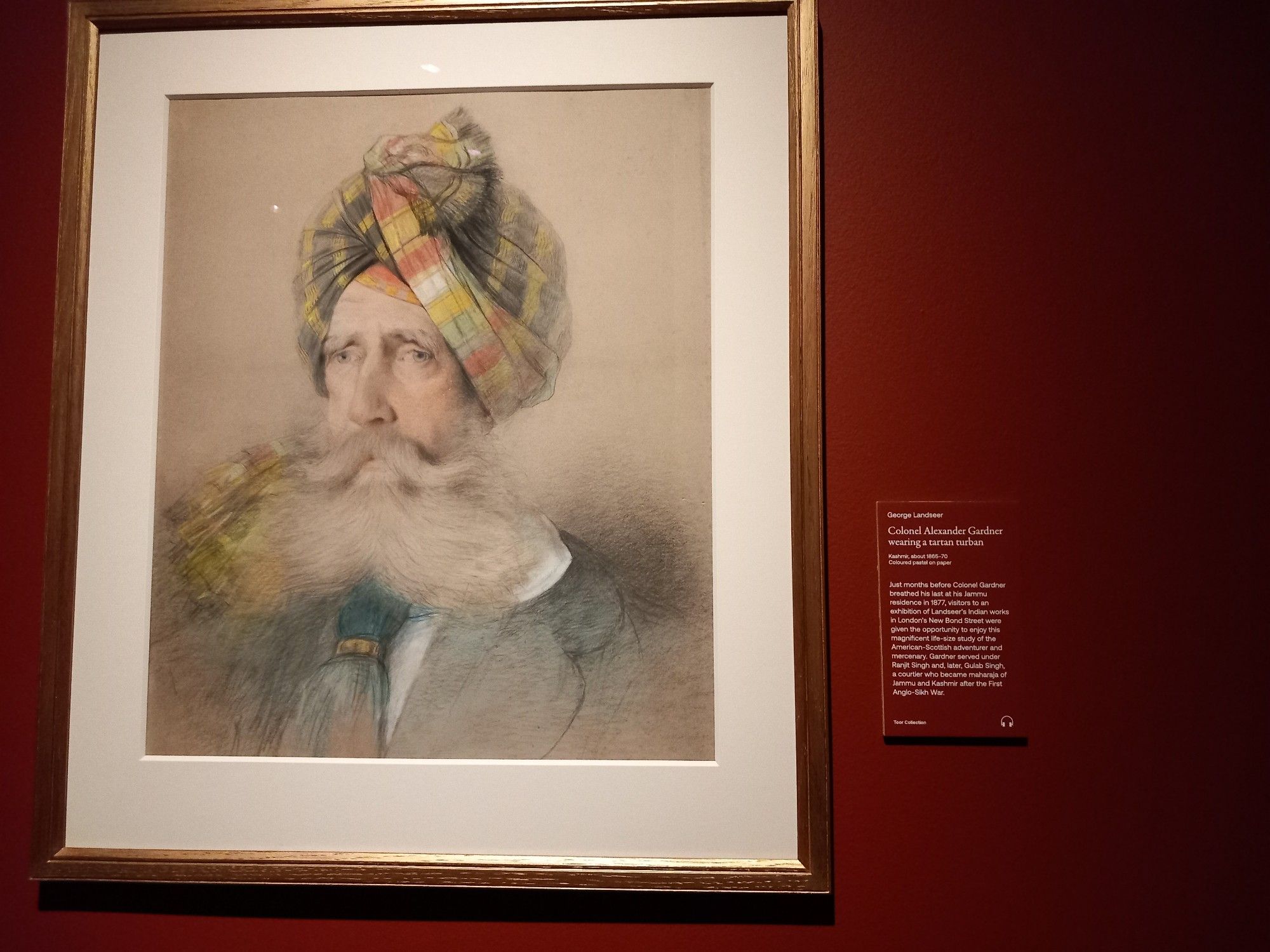 Bust portrait of a man with a vast white beard and moustache, and a tartan turban