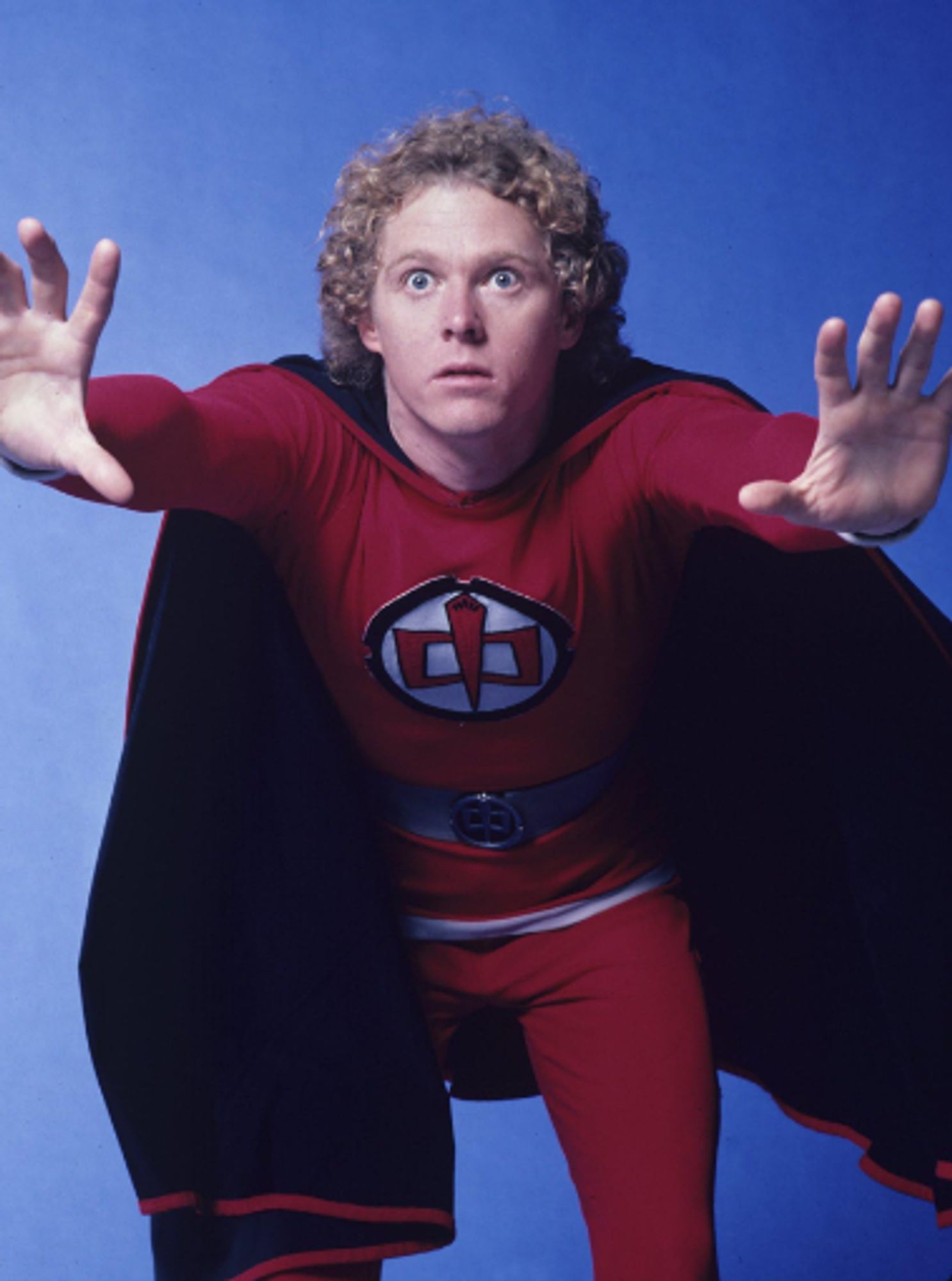 Actor William Katt in a pose wearing a red leotard with black cape as The Greatest American Hero