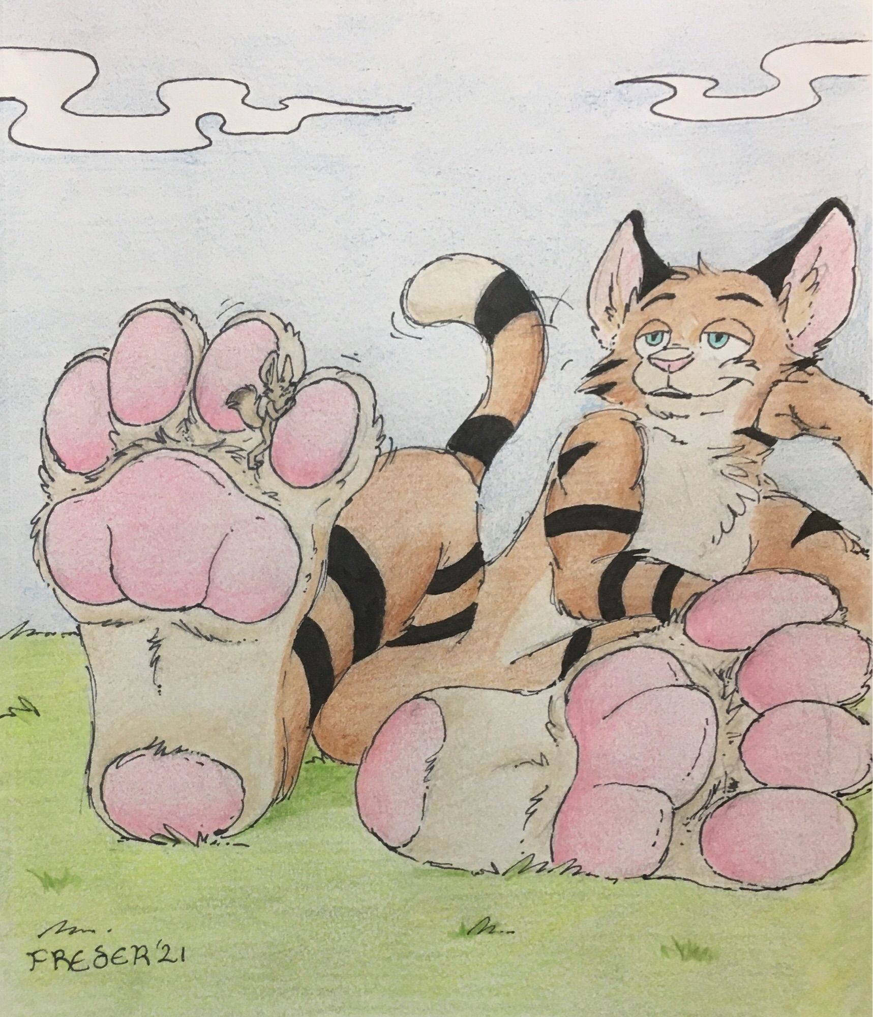 A very large brown feline with black stripes and pink paw pads lounges in the grass with a small fennec sitting between his toes