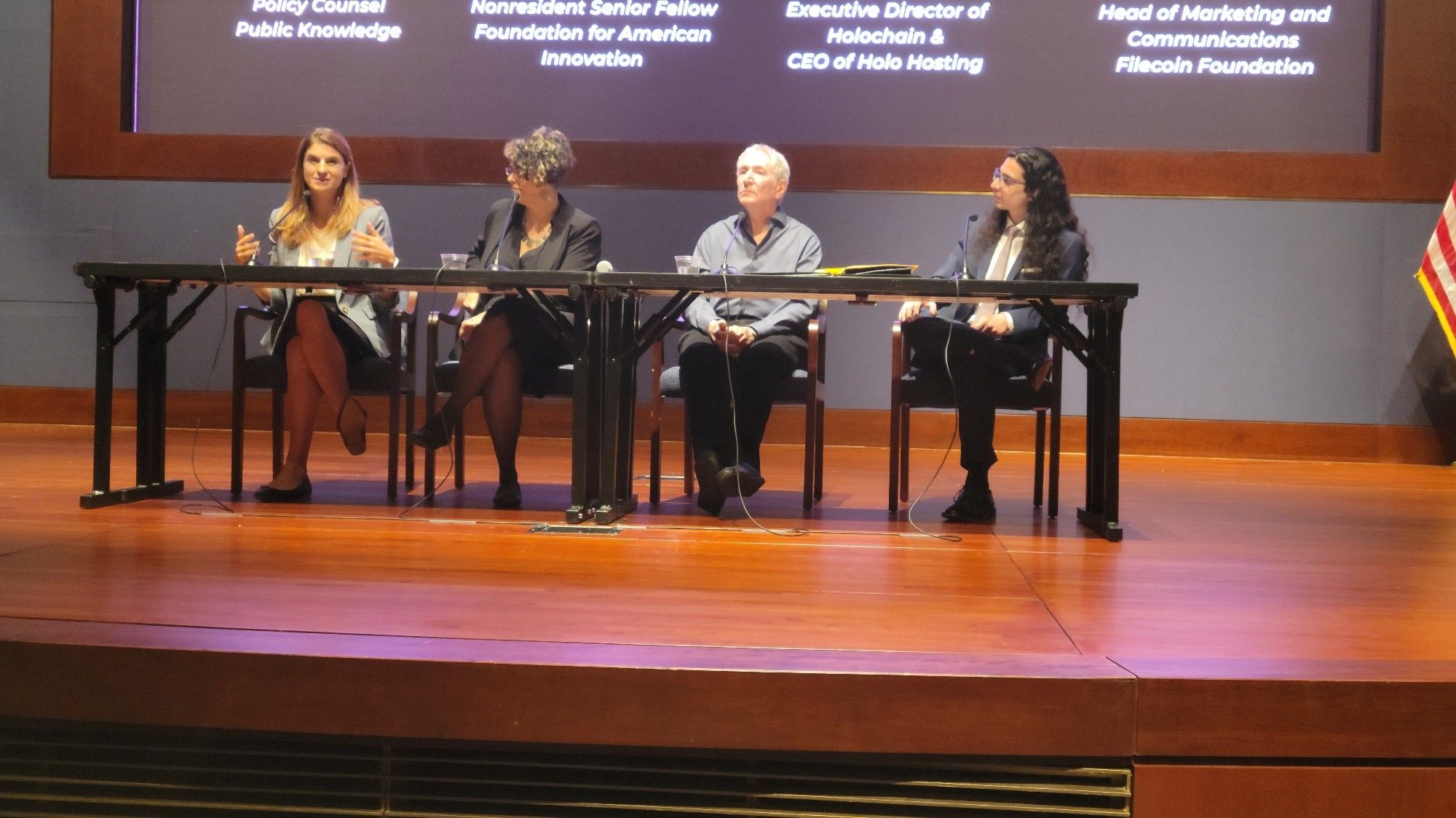 A photo of the panel "The Decentralized Web: Solutions for the Challenges of Centralized Technology" at Emerging Tech, with panelists Rachel Greenhorn, Head of Communications at Filecoin; Mary Camacho, Executive Director at Holochain; Richard Reisman, Nonresident Senior Fellow at Foundation for American Innovation; and Nick Garcia, Policy Counsel at Public Knowledge.