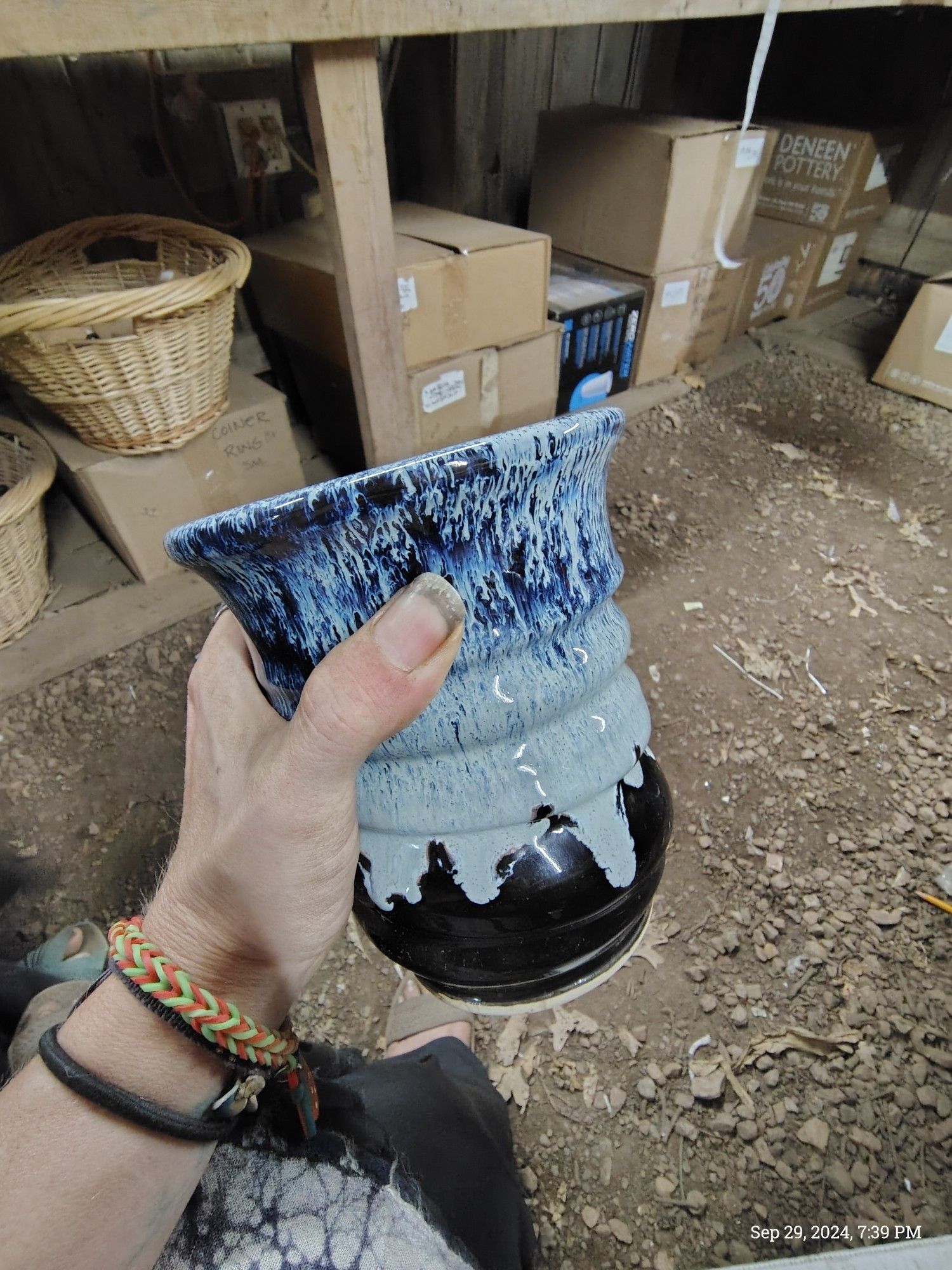 A very large ceramic mug with a blue to black wash