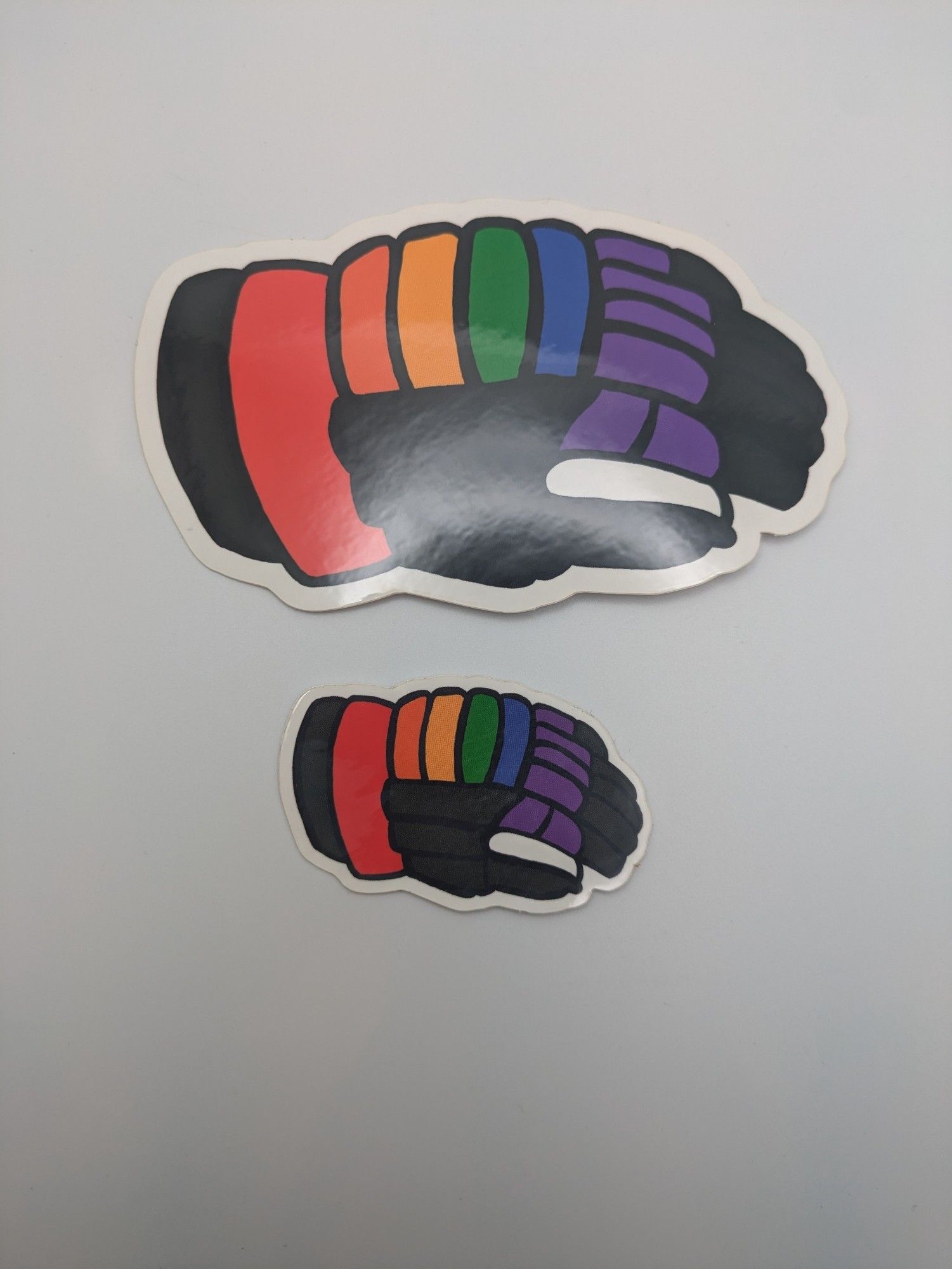 Size difference between the big and small rainbow glove. The big one is more than twice the size!