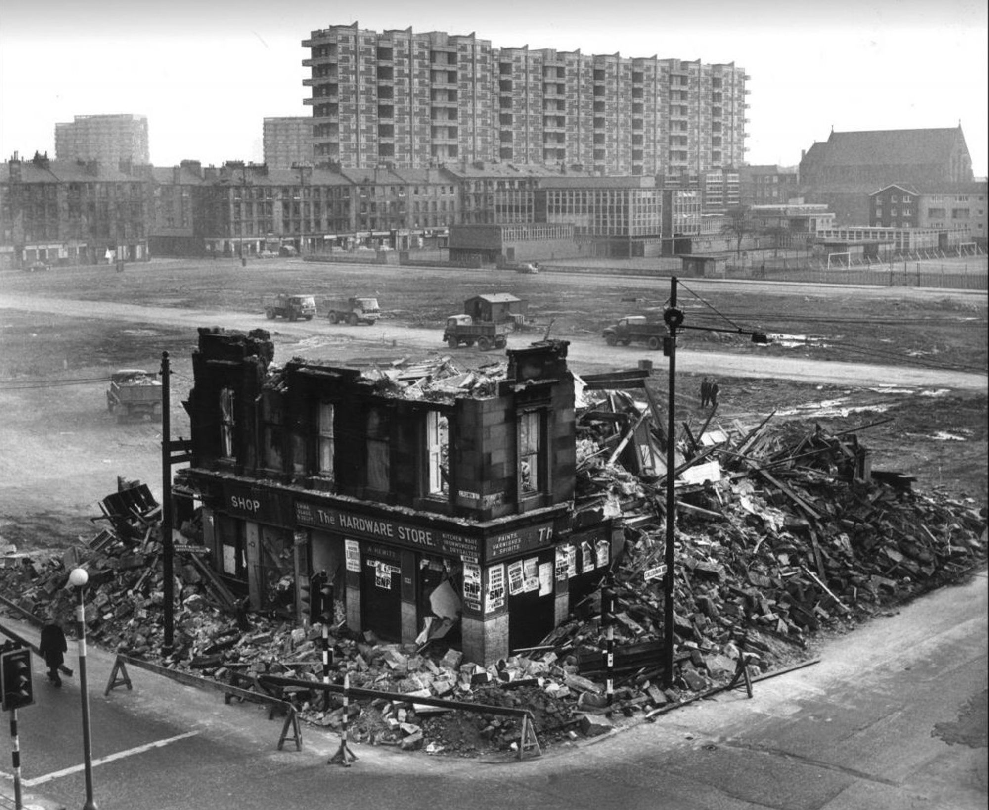 Part demolished tenements in the Gorbals with the newly built Hutchesontown C flats designed by Basil Spence in the background, photographed in 1968.