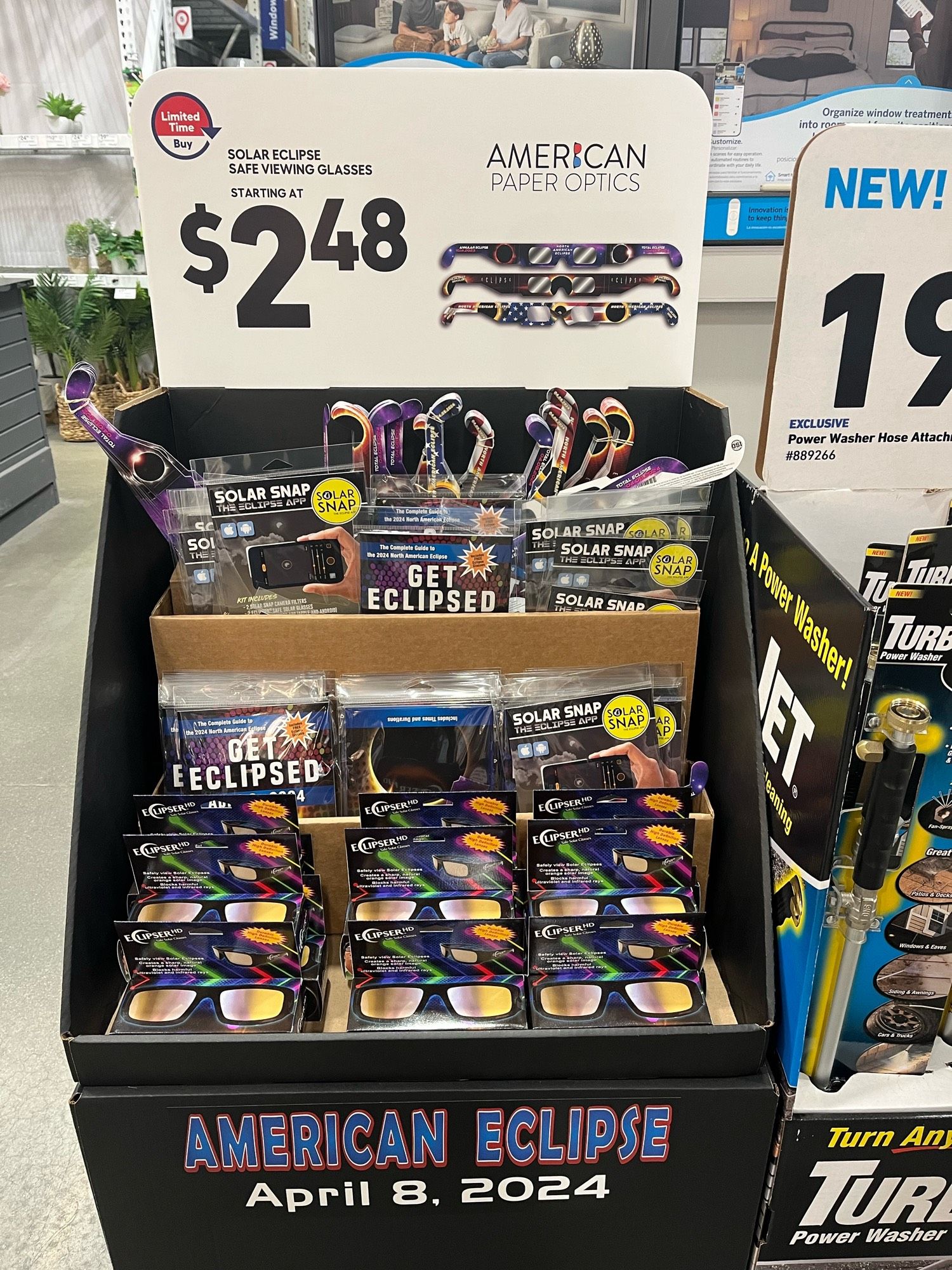 A display of eclipse glasses at Lowe’s Home Improvement, the display reads “American Eclipse April 8, 2024”