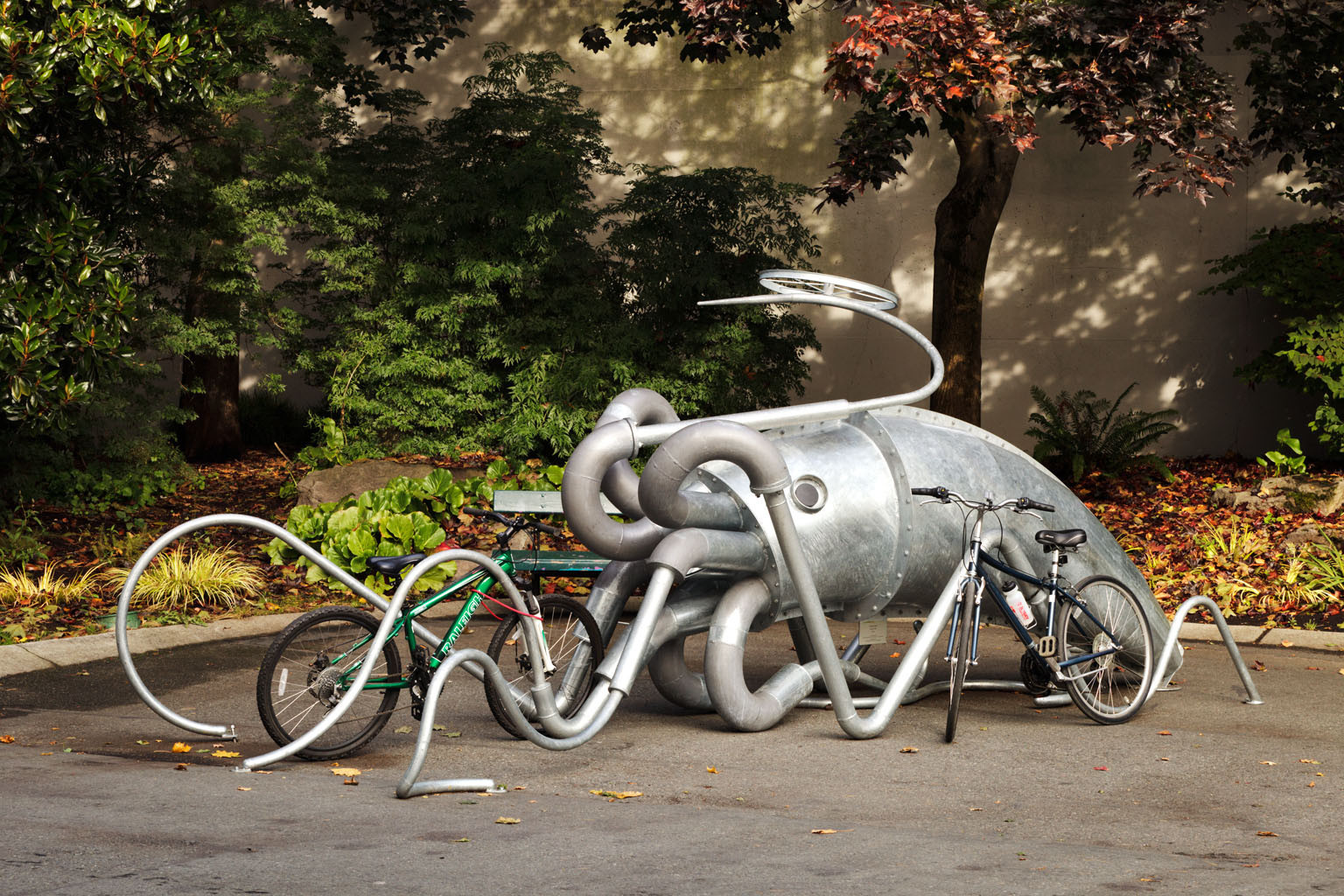 A giant metal squid that is also a rack for parking bicycles.