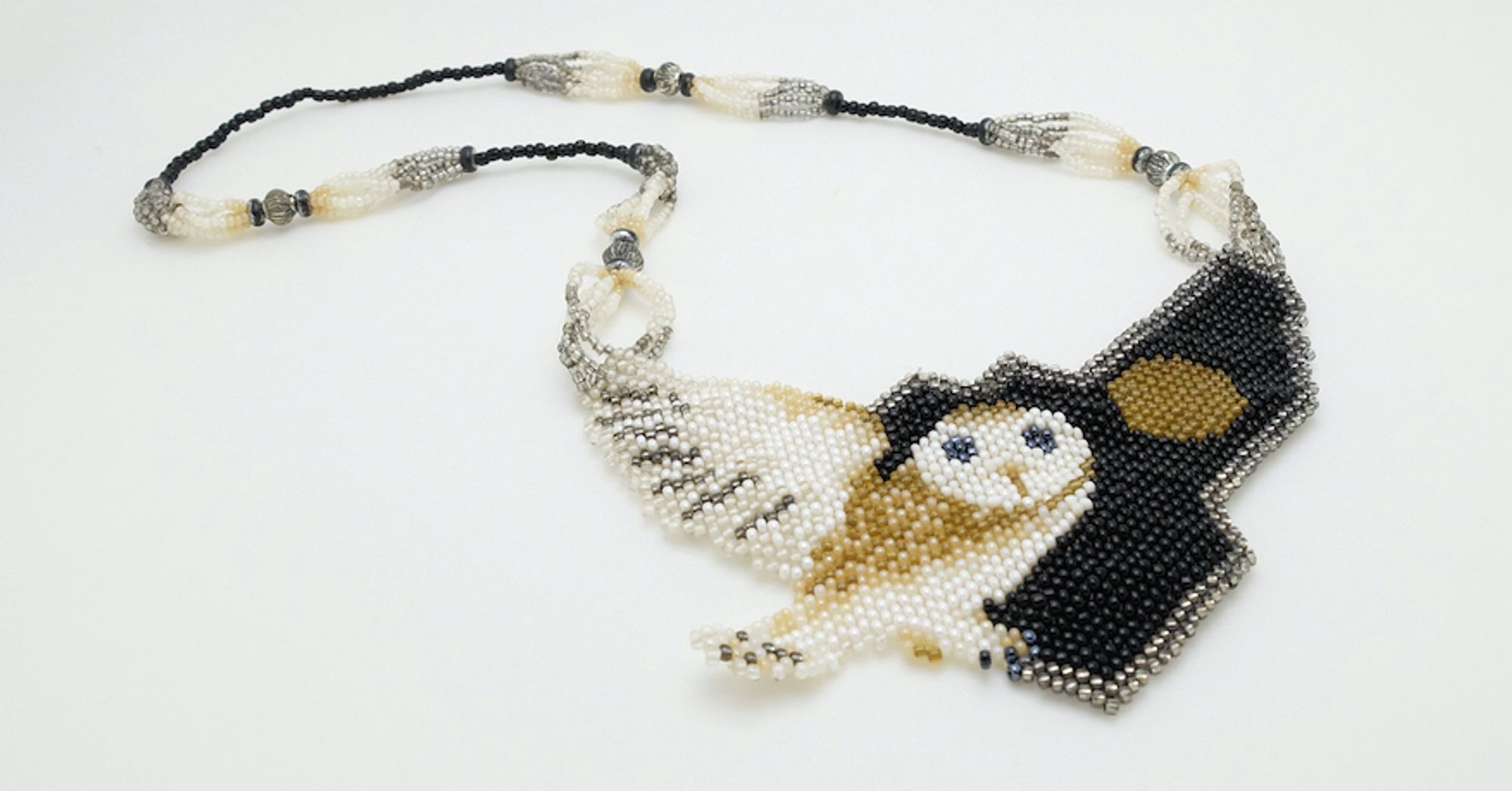 A seed bead necklace with an owl pattern