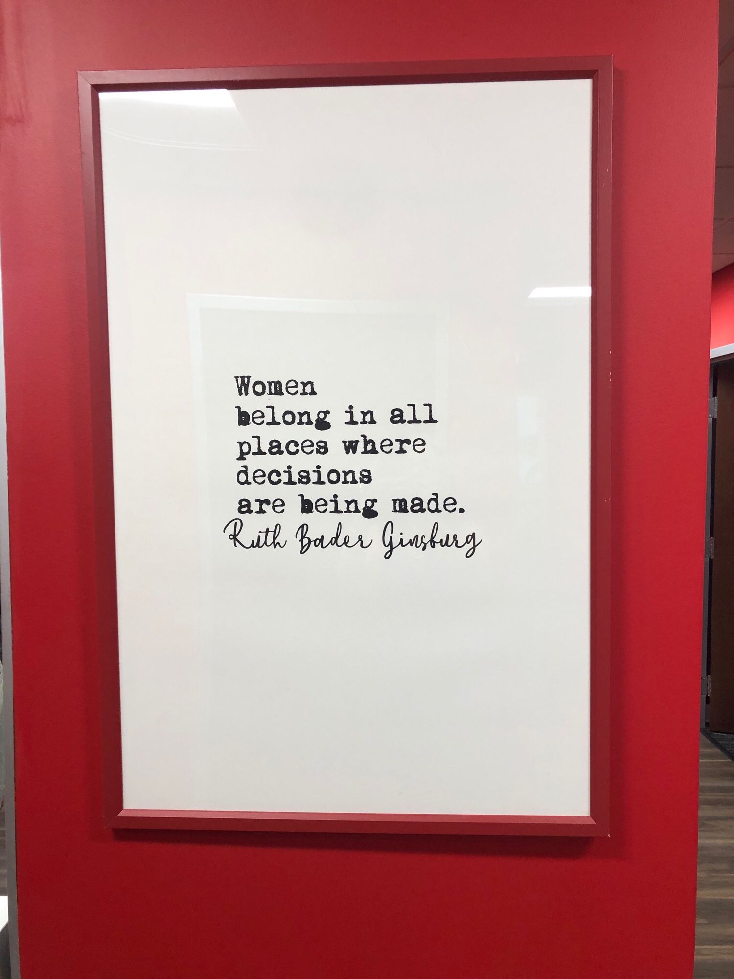 Sign in typeface: Women belong in all places where decisions are being made. - Ruth Bader Ginsburg