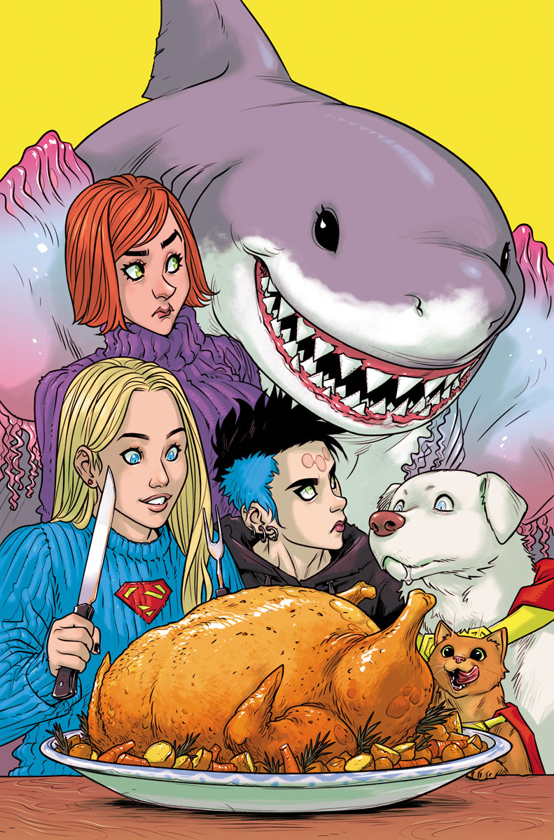 Supergirl, Lesla-Lar, Lena Luthor, Krypto, Streaky, and Princess Shark all huddled over a big Thanksgiving turkey. Princess Shark is crowding everyone and Lesla and Lena look at her with annoyance.