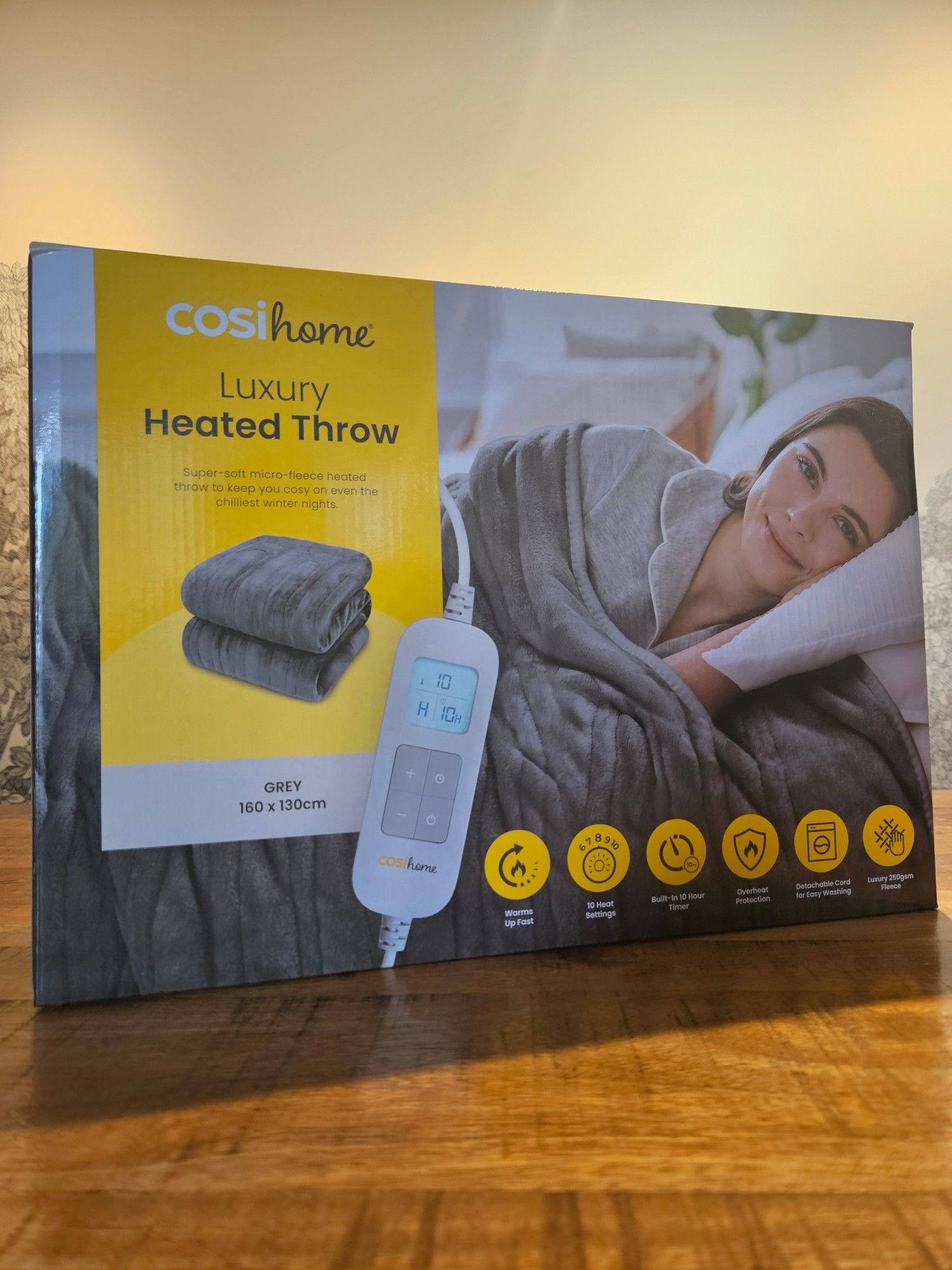 A box containing a CosiHome luxury heated blanket.