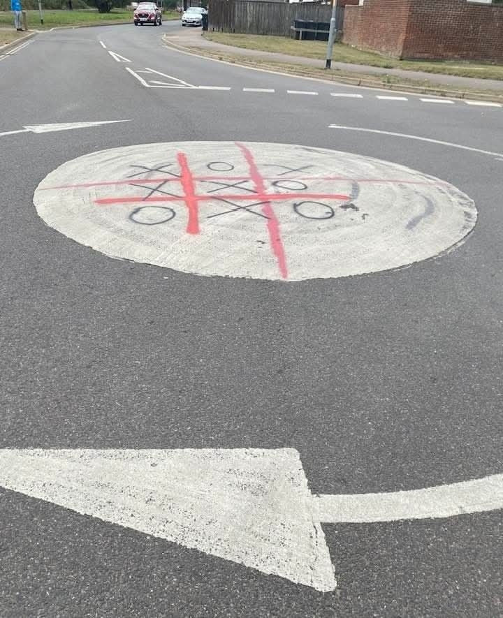 England flag painted on roundabout turned into noughts and crosses game.