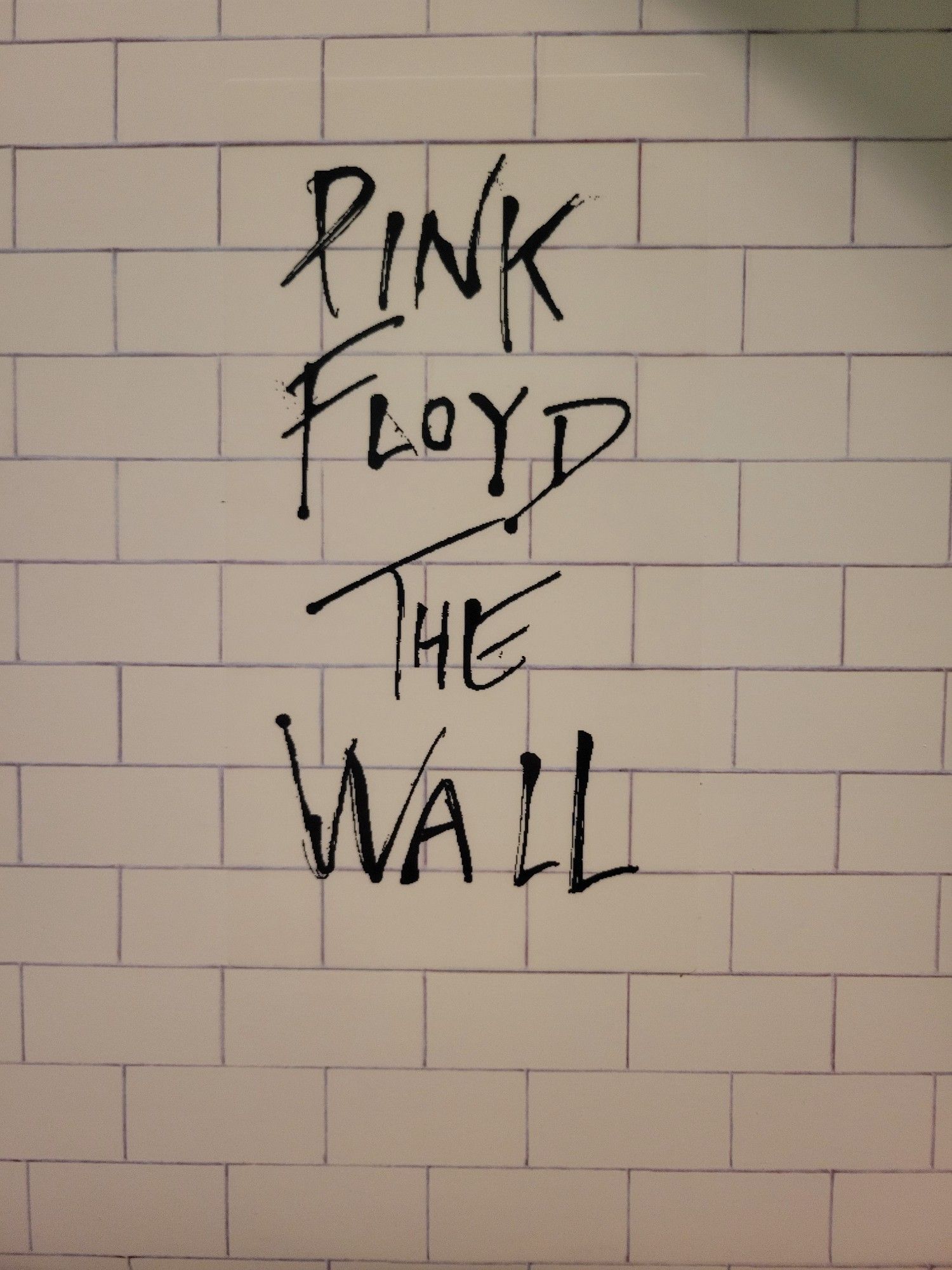 Simplest ass album cover ever, it's The Wall by Pink Floyd