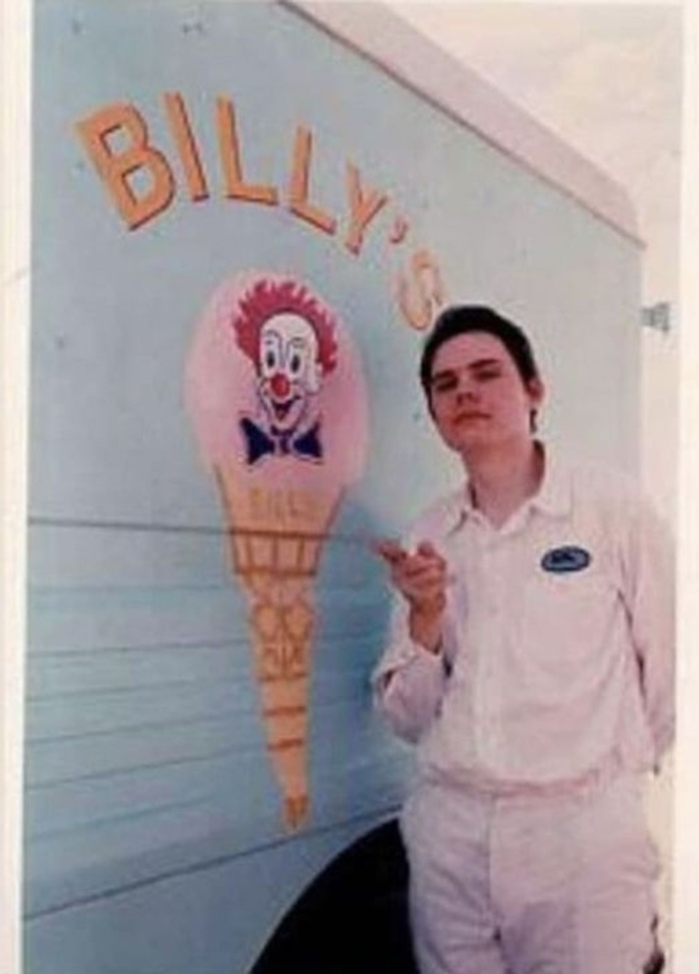 Billy Corgan of the Smashing Pumpkins dressed all in white pointing at an ice cream truck with 'Billys' written on the side