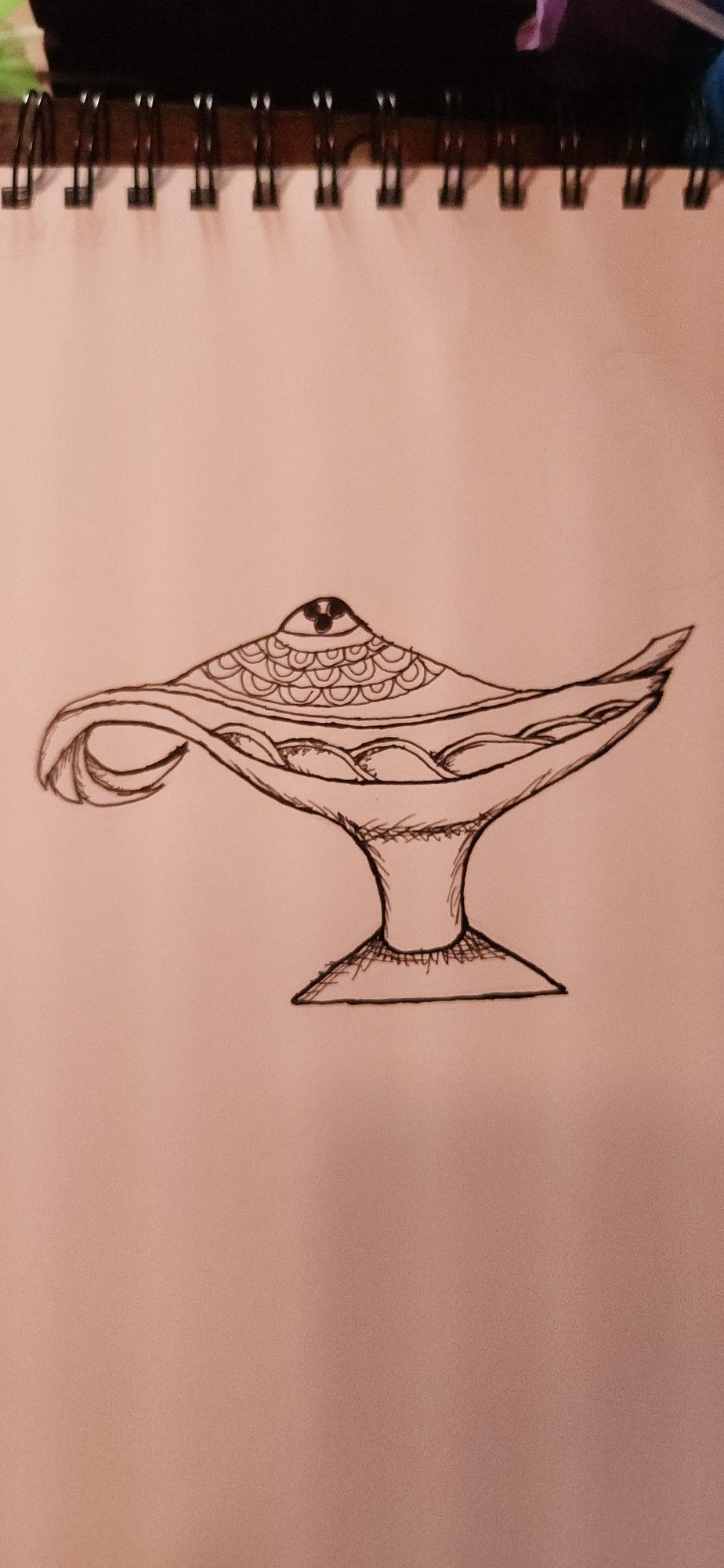 A pen drawing of an Arabian oil lamp.