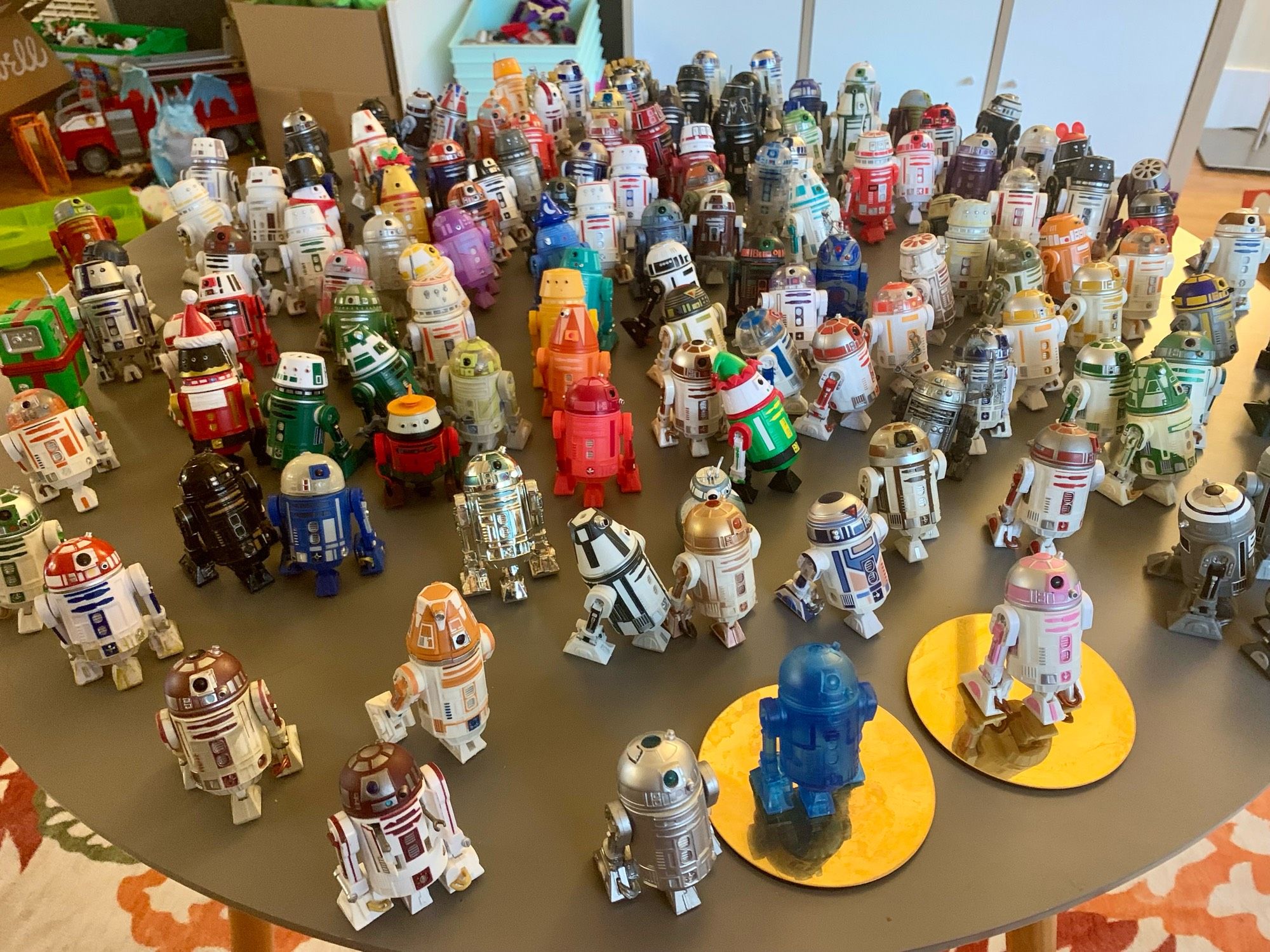 Photo of lots of astromech droids on a coffee table