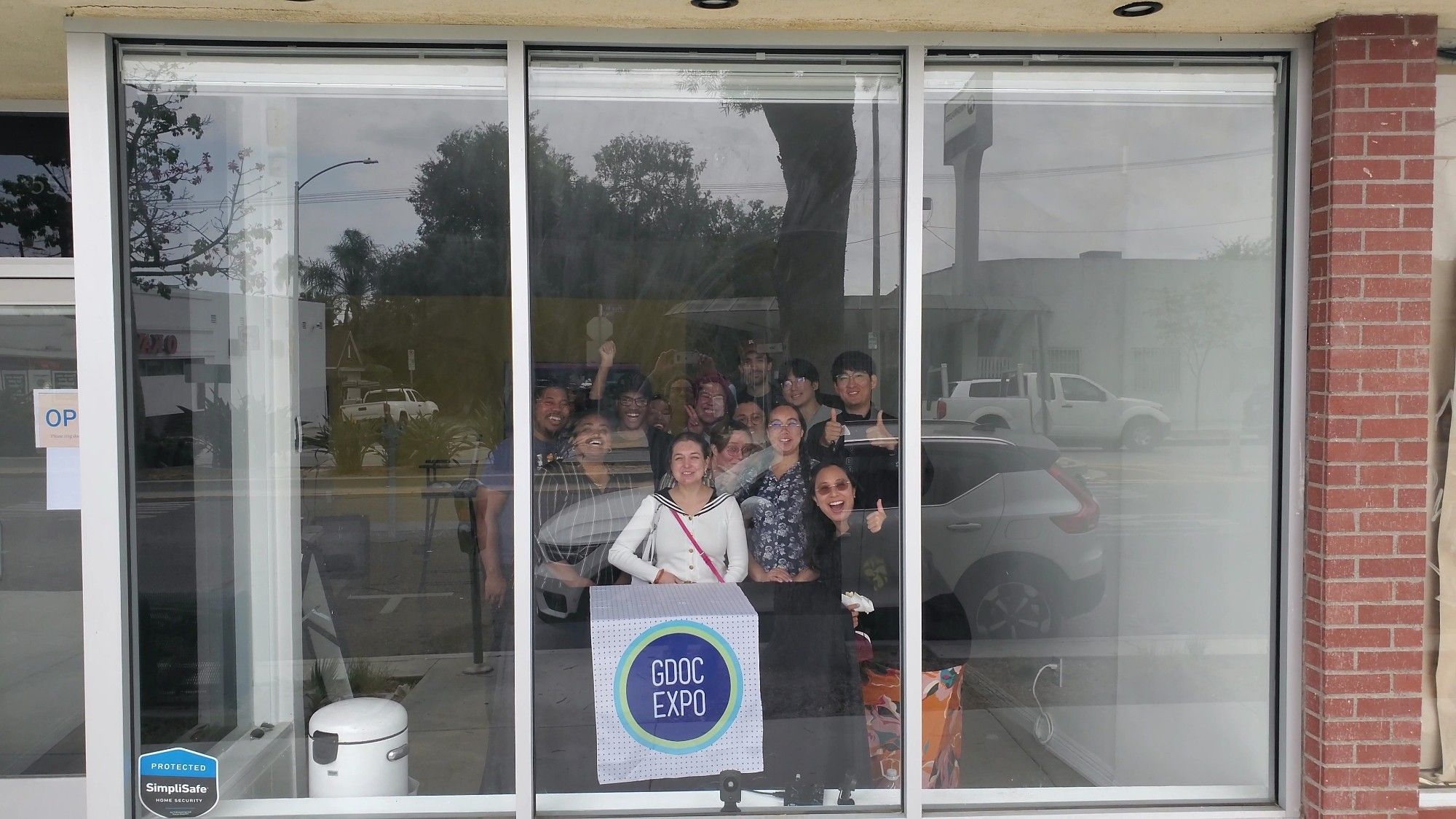 Its a picture of the GamePlayArts LA Game Devs of Color Expo watch party. Its a group photo with everyone at the event.