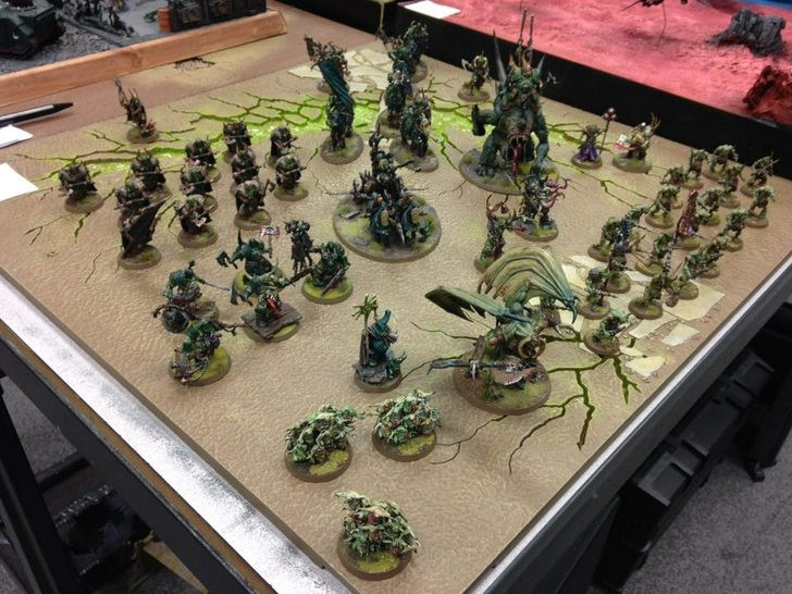 A Nurgle army laid out on a square board for Armies on Parade 