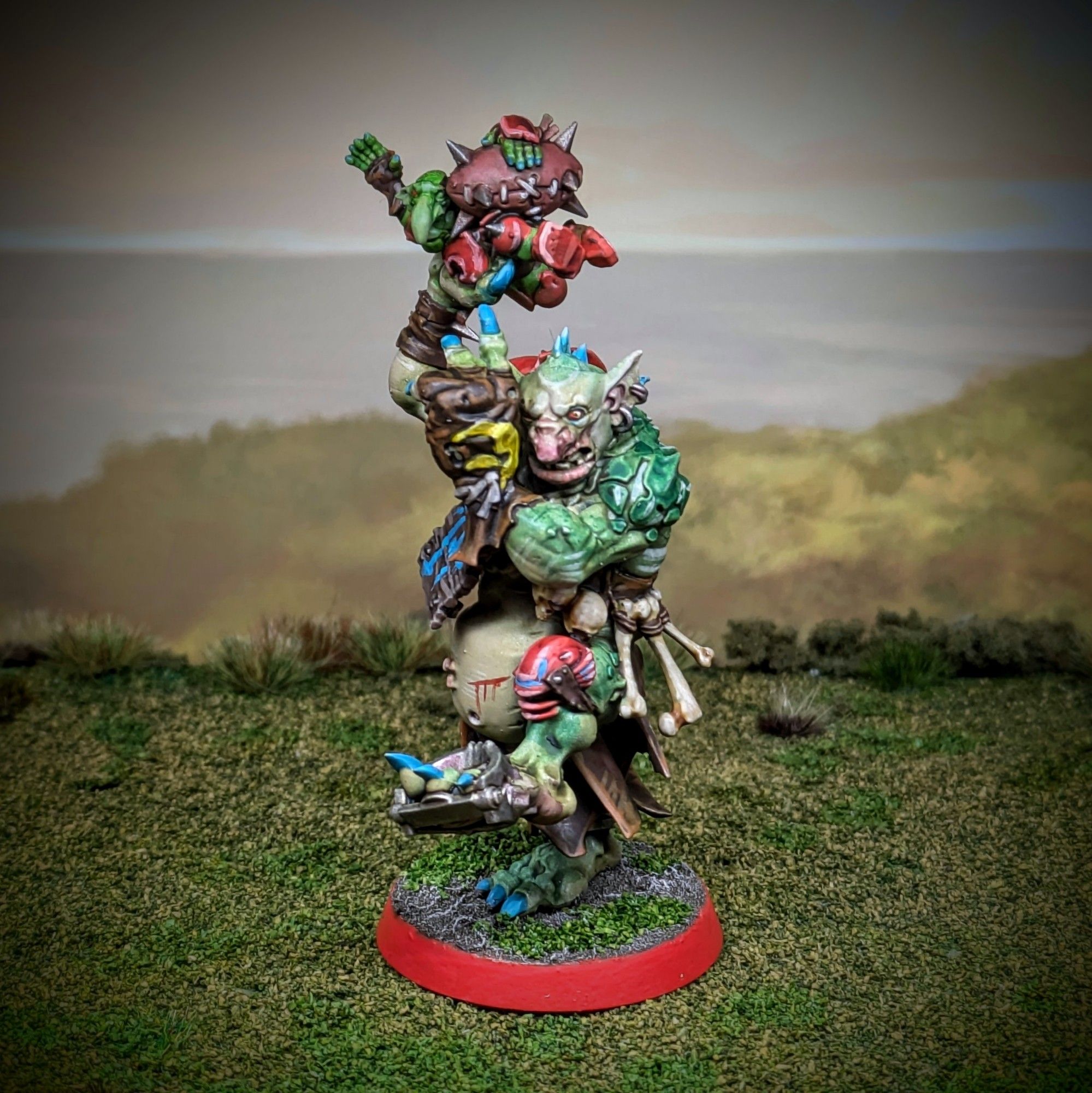 Blood Bowl troll miniature, about to fling a goblin across the pitch