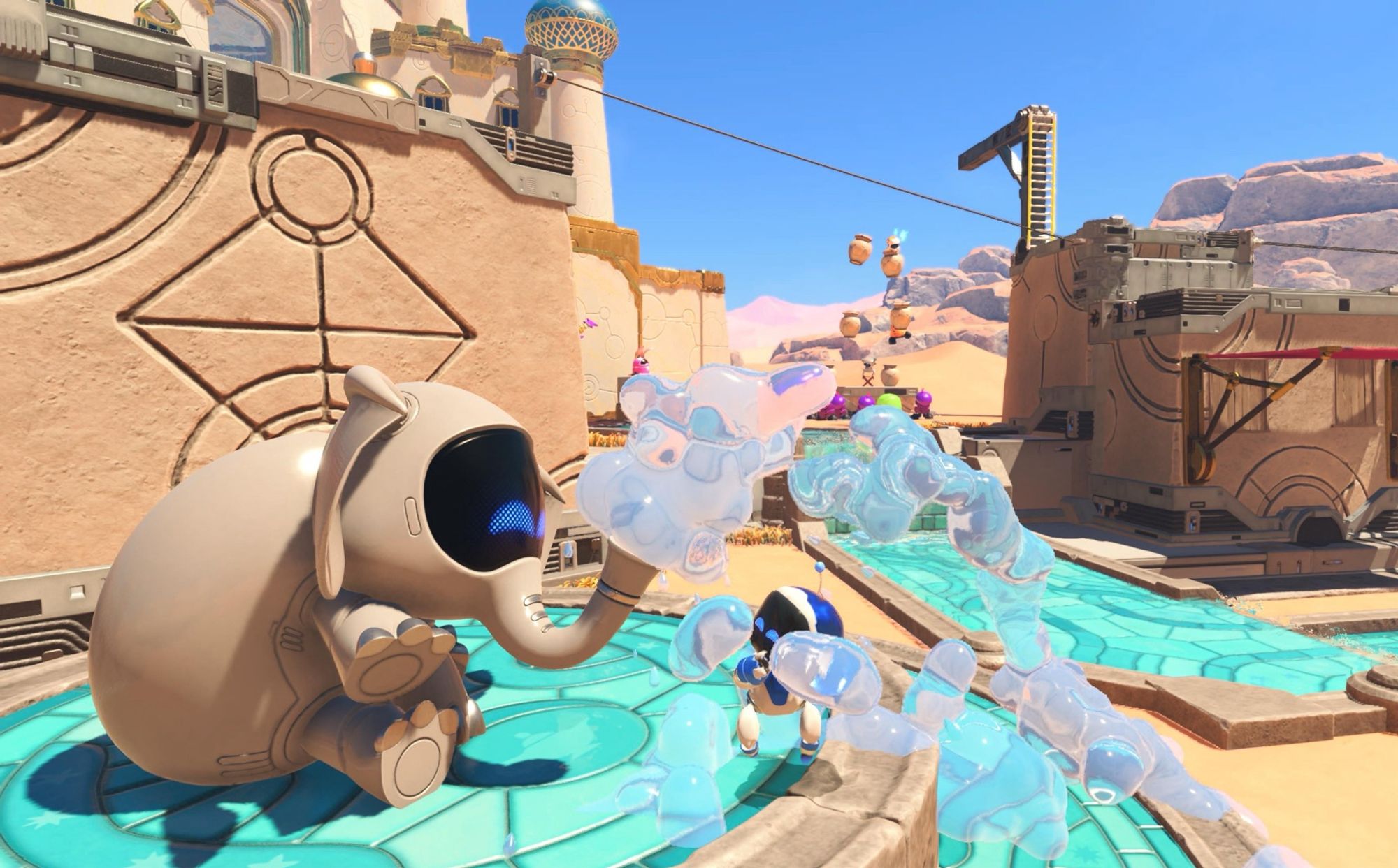 a screenshot of Astro Bot in a desert stage with a robot elephant sitting and spraying water