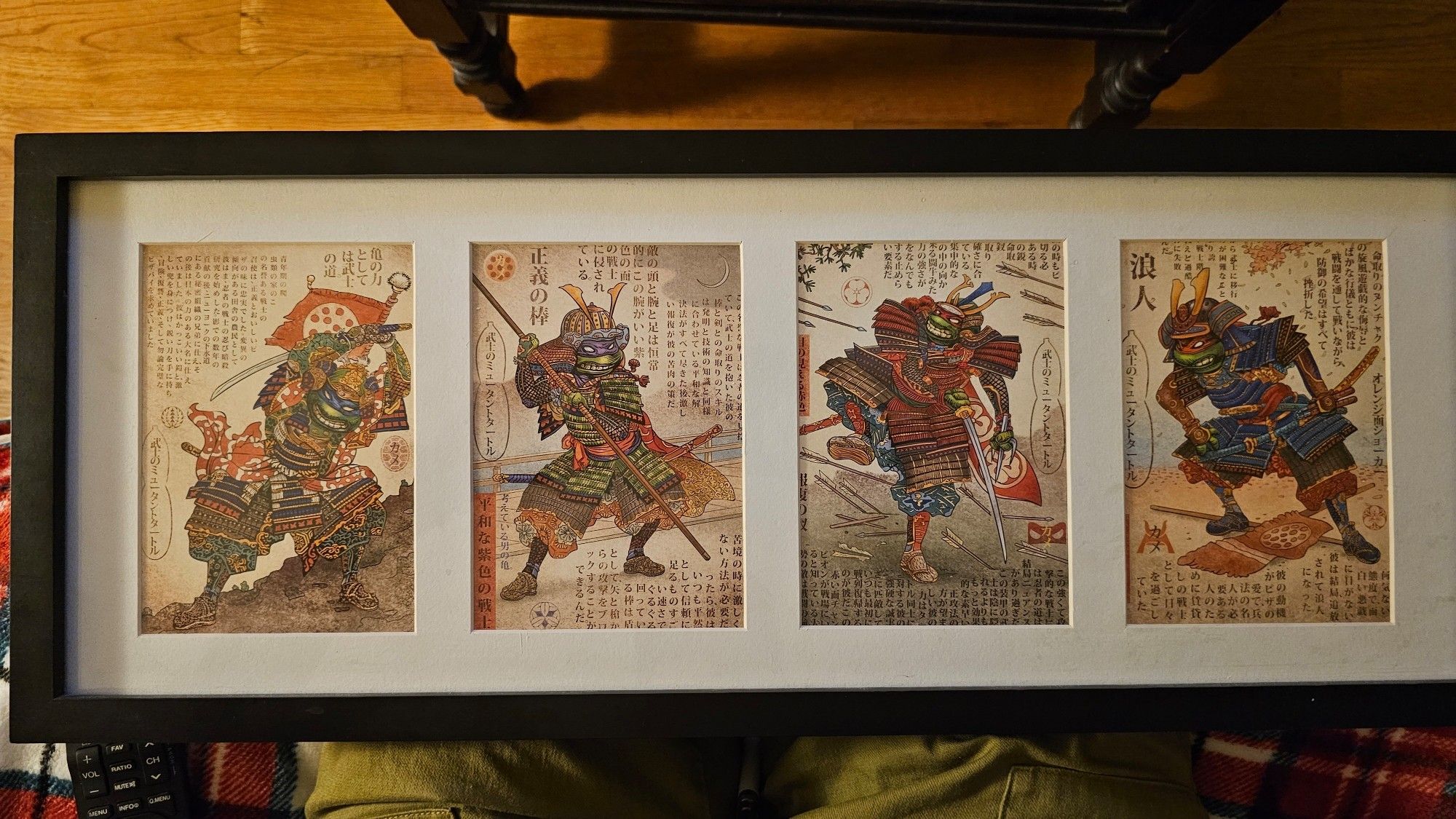 Traditional style Japanese art of the Ninja Turtles in samurai armor with Japanese text around and behind them