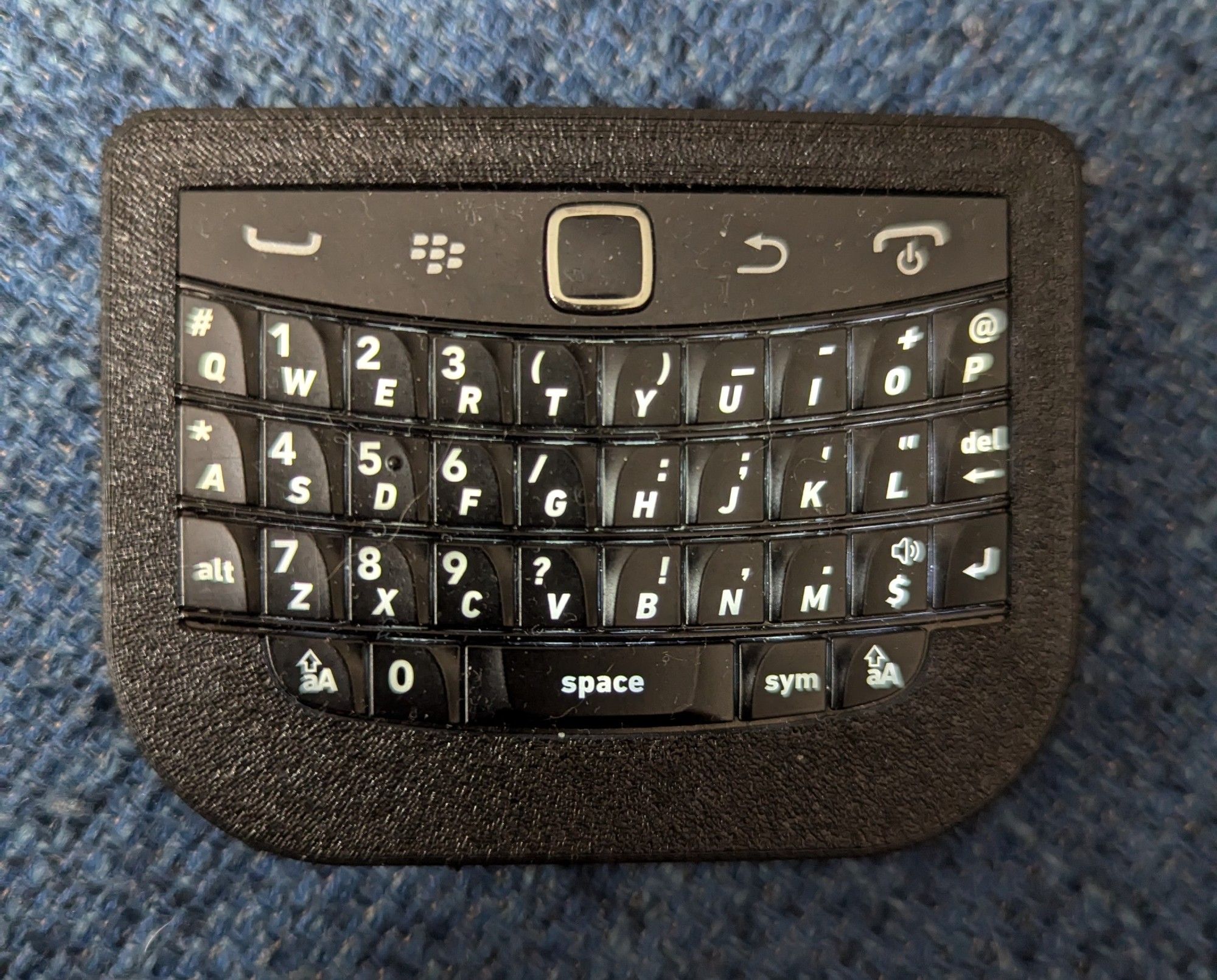 A Blackberry keyboard built into a custom 3D-printed case and modded to connect via Bluetooth.