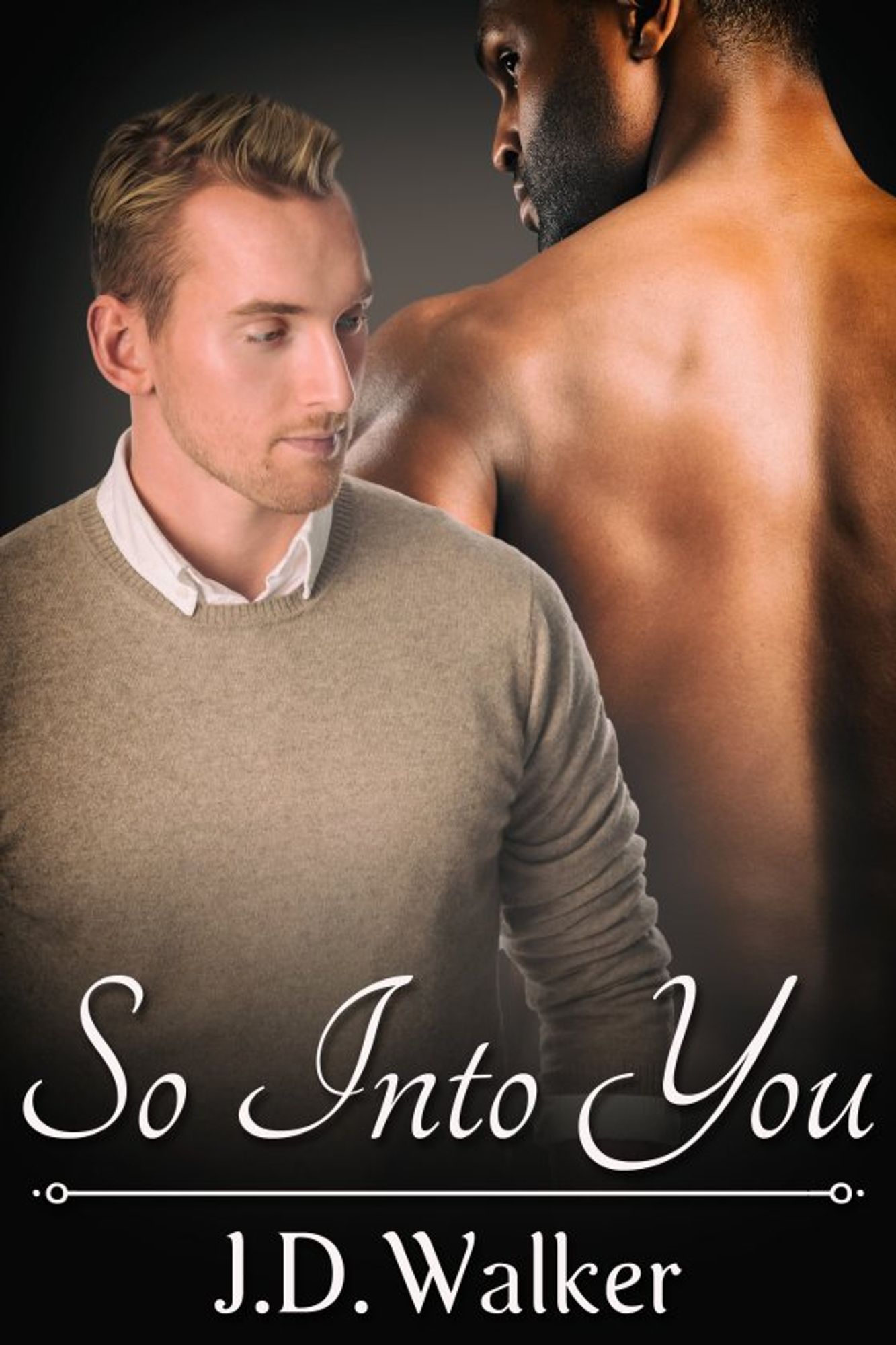 So Into You  by J.D. Walker
In the image are two men. In the foreground is a man wearing a beige sweater over a white Oxford-style shirt. He has pale, pink-toned skin, short dark blond hair and a neat day-old moustache and beard. He is looking to the left. In the background is a man with dark brown skin, shirt-less, his back to the reader, short black hair and a neat moustache and beard. He is looking to the left.