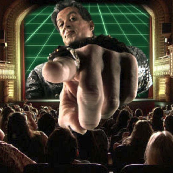 Sylvester Stallone as Toymaker in Spy Kids 3-D pointing towards the screen with an exaggerated 🫵