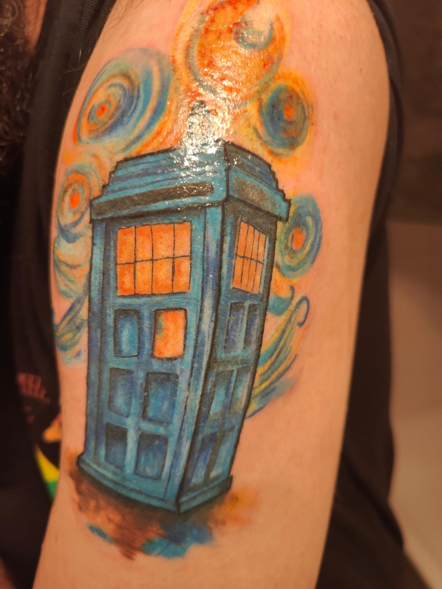 Photo of a tattoo, the Tardis, in the style of 
Van-Gogh