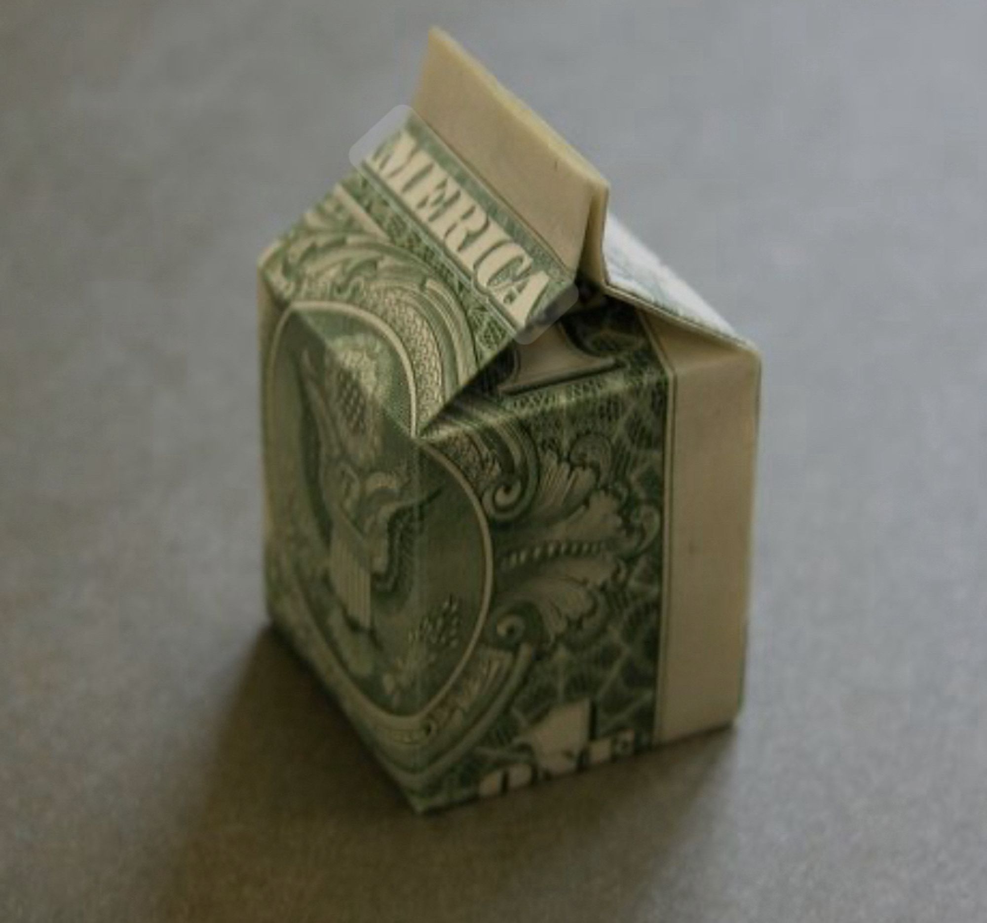 A dollar folded into a box shape