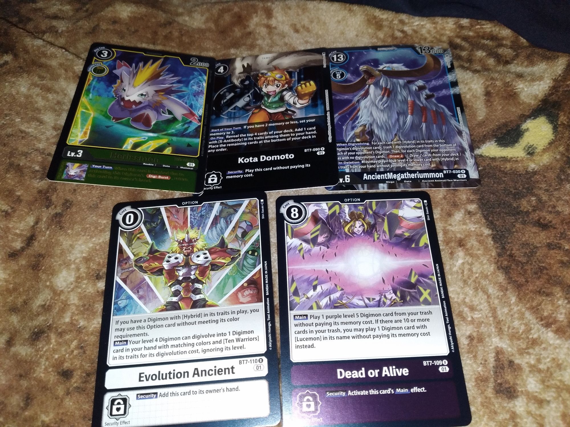 5 digimon holo like cards with various texts of different digimon, characters and trap/magic cards...