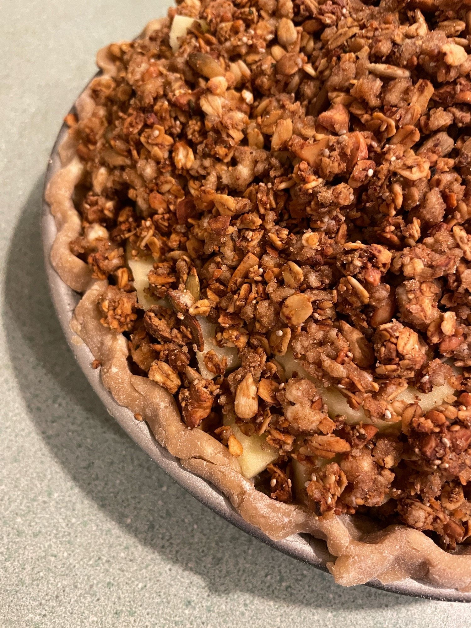 homemade apple pie with crumble top about to go in the oven