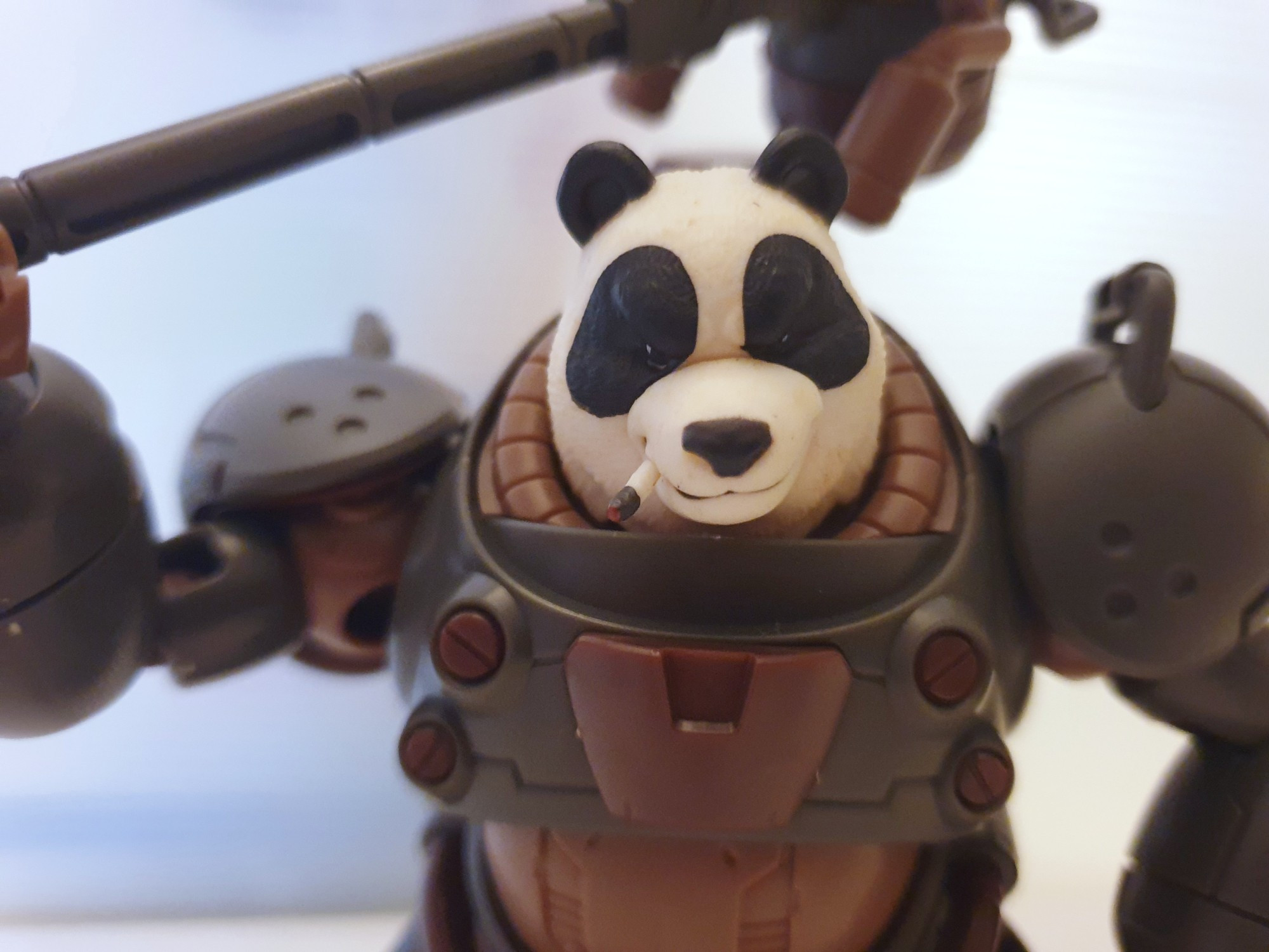 Close-up of Number 57 Manhunter Shenshu panda head on model kit.