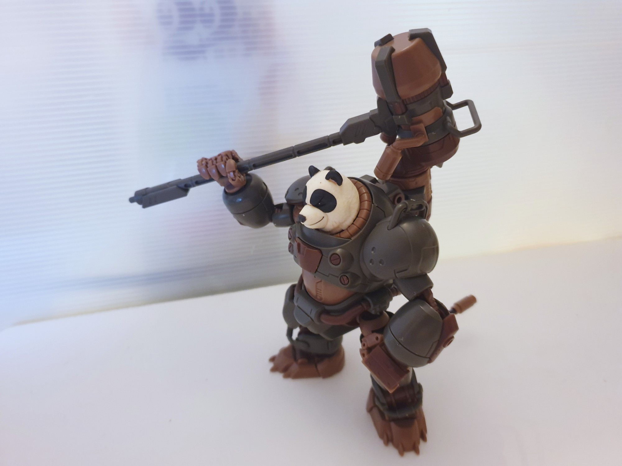 Side view of Number 57 Manhunter Shenshu panda armor with hammer, hammer has jet boosters