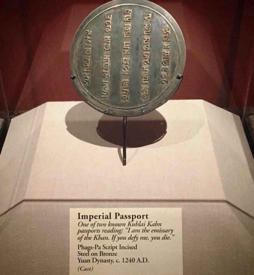 A photograph of a museum case containing a bronze disc seal carried by envoys of Kublai Khan around 1240 CE.
It reads "I am the emissary of the Khan. If you defy me, you die."