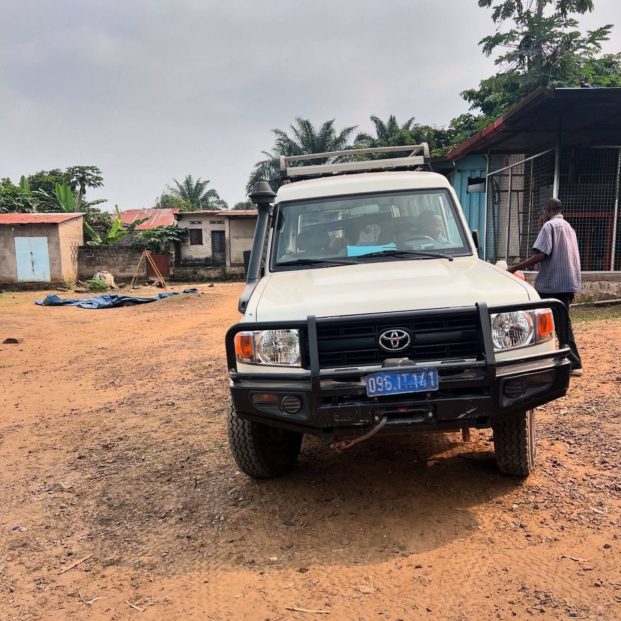 an SUV in a Congolese village