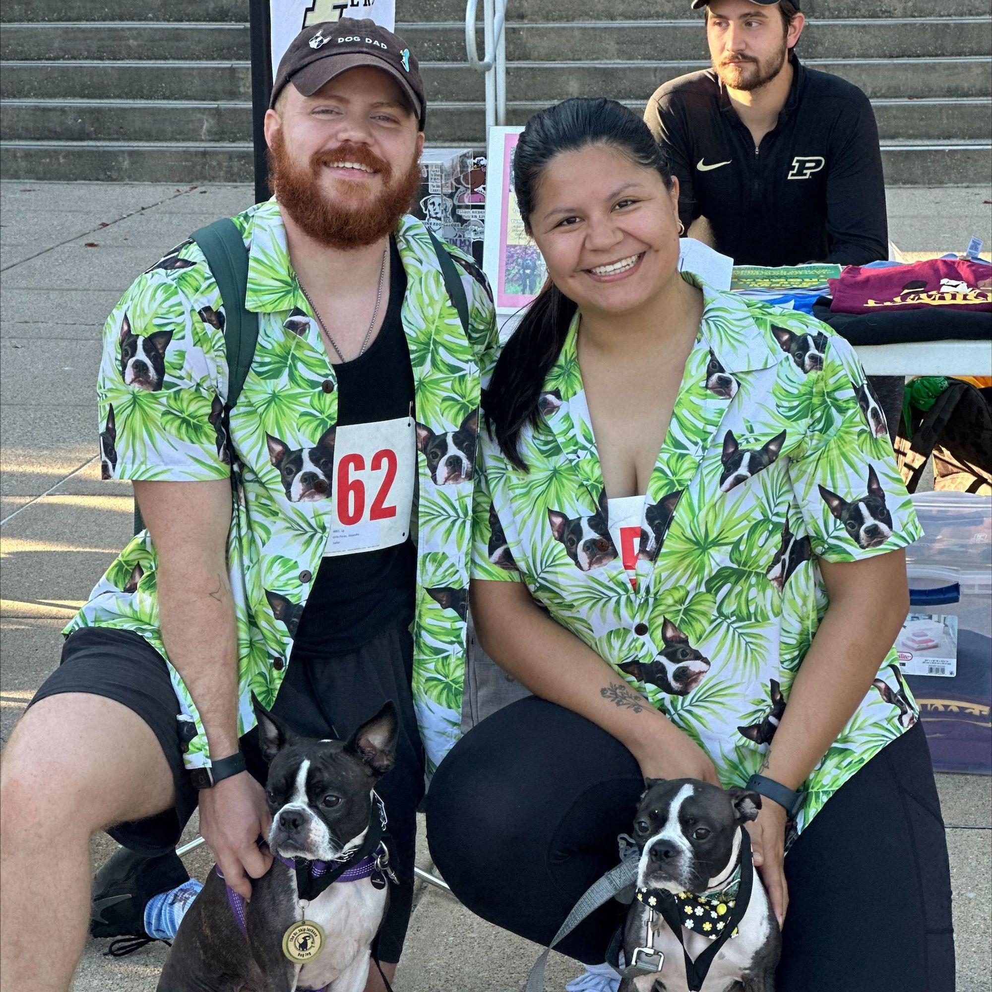 two people and their dogs