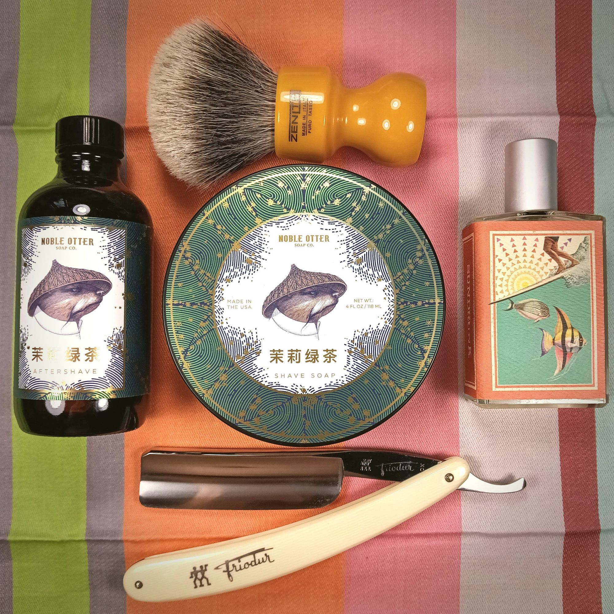 A set of Noble Otter 茉莉綠茶 with a bottle of IA Sundrunk, a pretty butterscotch Zenith boar and a bi Frio 14