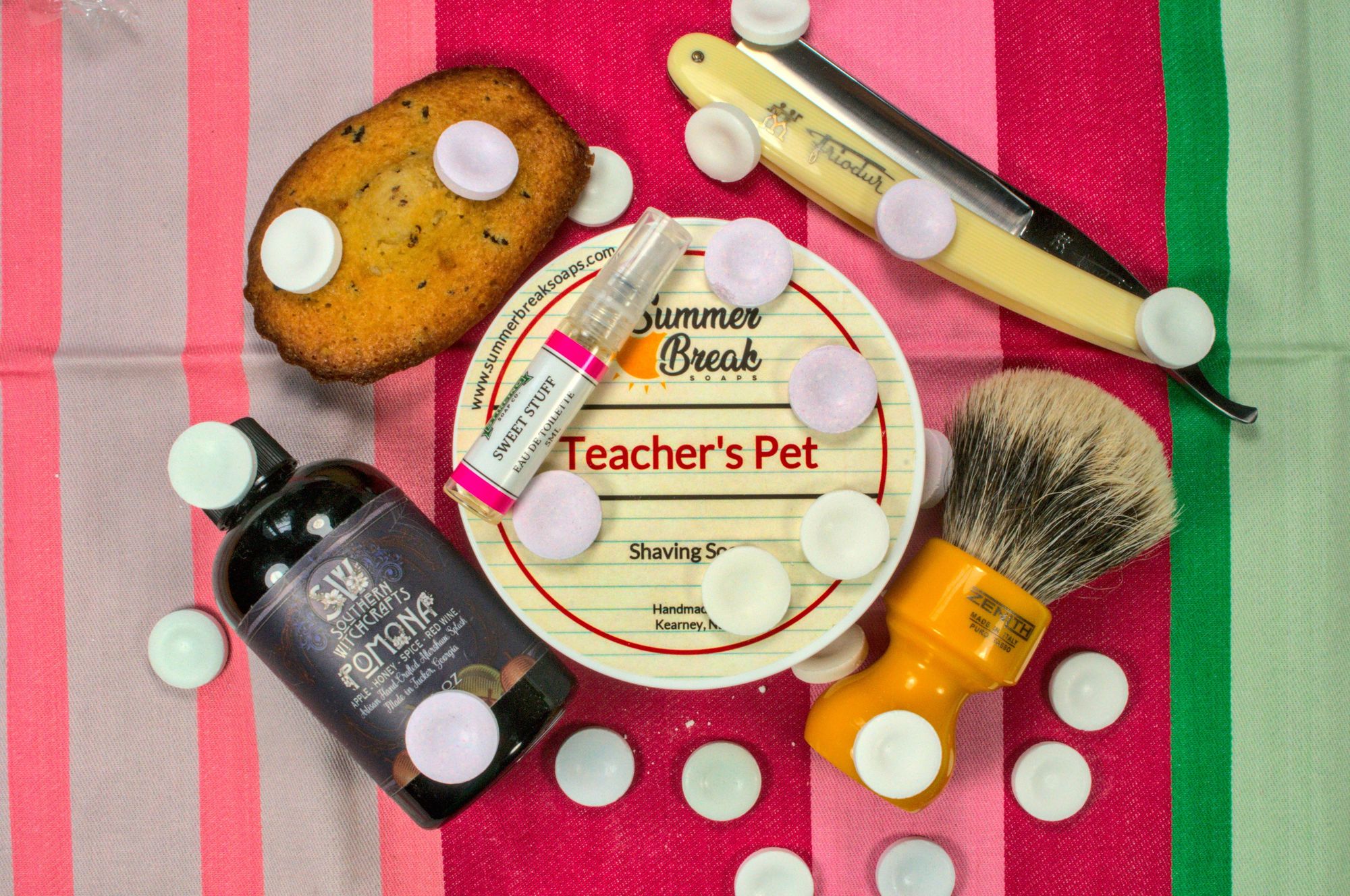 A tub of teacher's pet with pomona splash and sweet stuff frag, a Friodur 14 straight razor and a Zenith badger brush