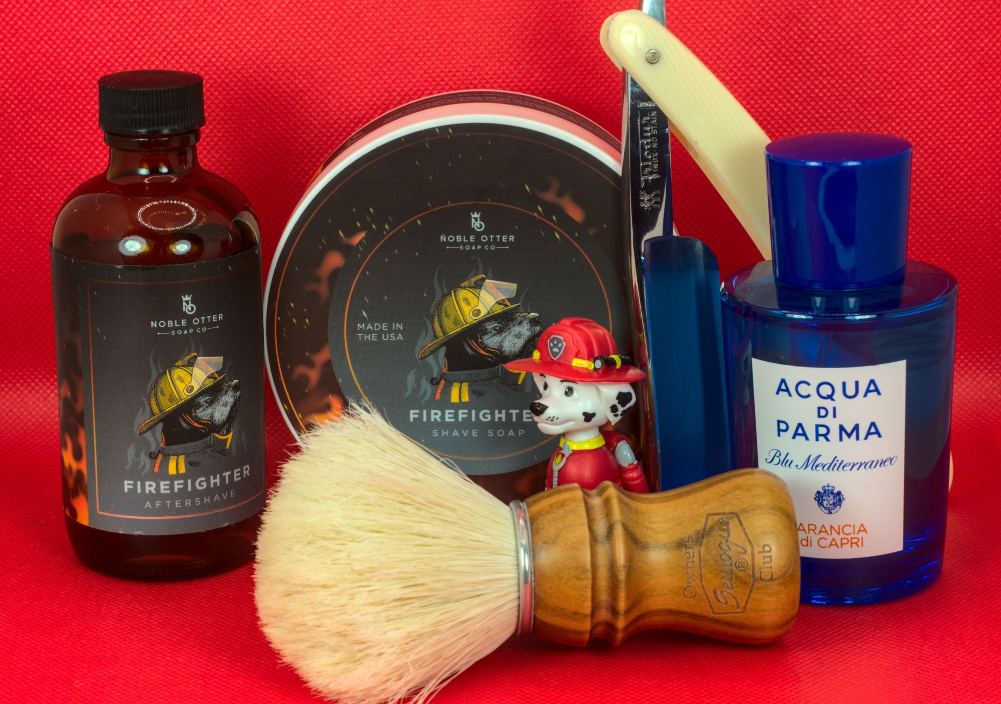 a set of NO Firefighter soap and splash, with a bottle of AdP Arancia di Capri frag, a chonky Frio 17, and a SOC boar brush.
