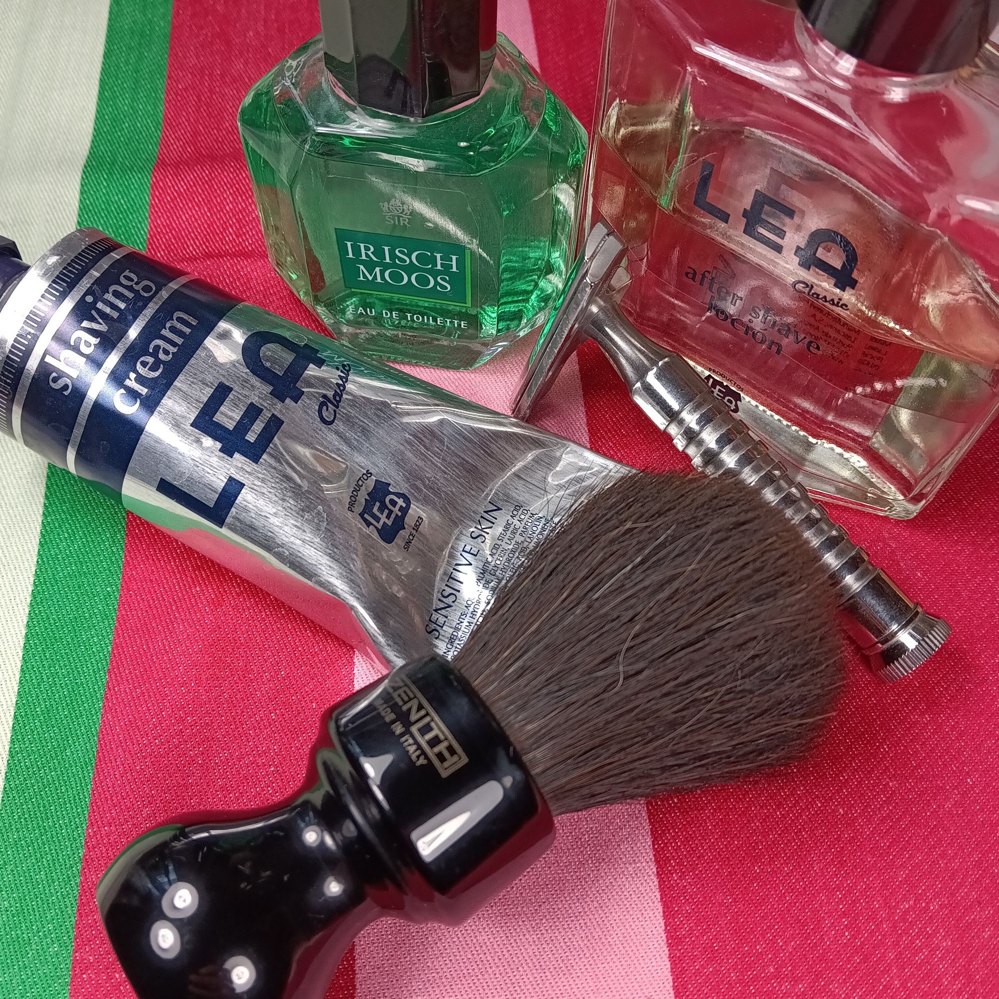 A tube of Lea shaving cream with matching splash next to a Zenith Horse brush, a Hawk razor, and a bottle of Irisch Moos EdT