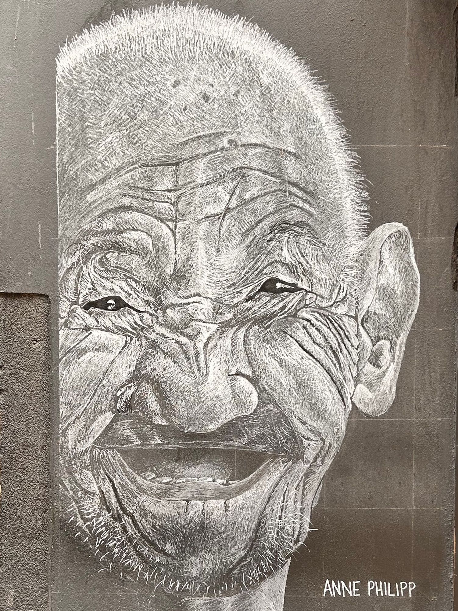 A black and white sketch of an happy old man
