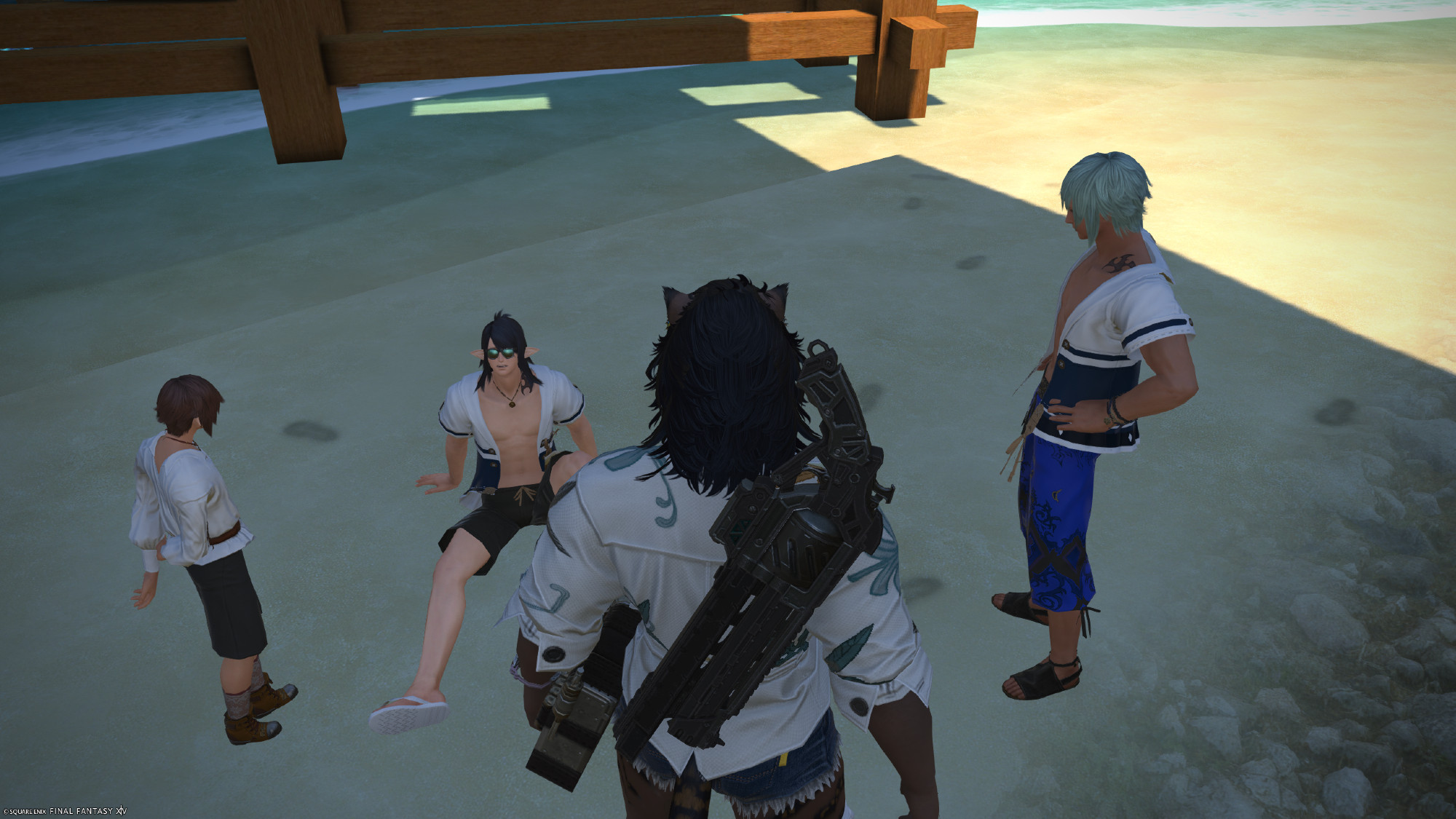 screenshot from final fantasy 14 of a group of characters. Honoroit; a child elezen who is standing to one side, Emmanellain; an adult elezen who is sitting on the floor looking tired, and Sicard, an adult hyur who is judging Emmanellain's latest failed attempt at the jump tower with amusement. they are grouped in the sandy shore below the tower and sitting in the shade.