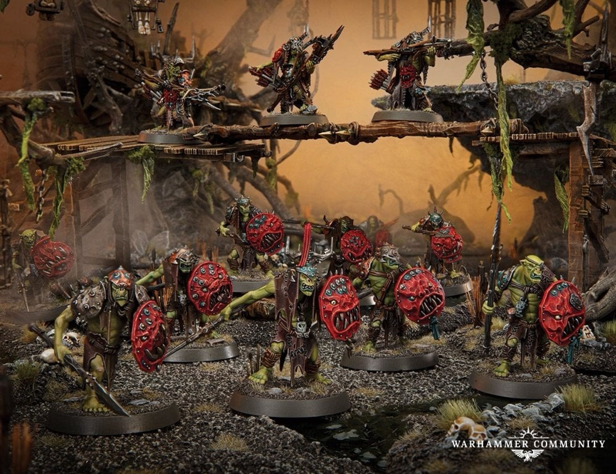 A picture of green skinned red shield hoisting, venemous spear toting miniatures from Warhammer called Kruleboyz.