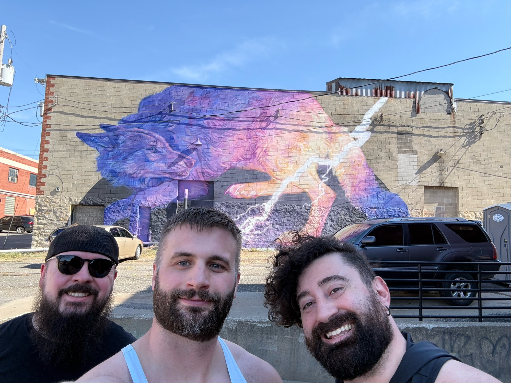 Posing in front of a wolf mural. 