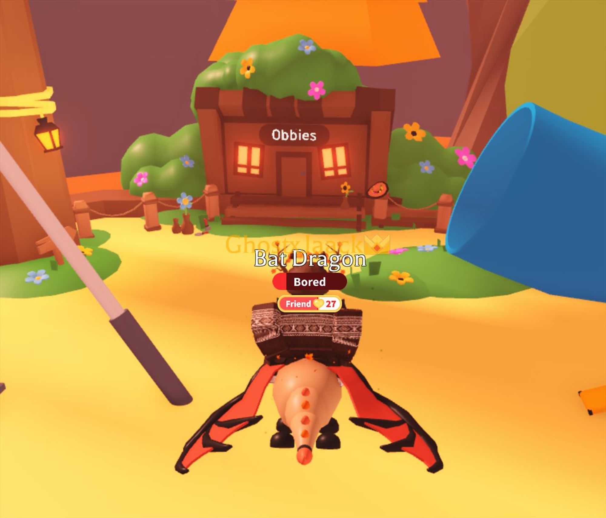 Image of me in Roblox Adopt Me, I am flying my Bat Dragon pet whilst in the Playground area, an "Obbies" portal can be seen, yet it still has decorations for the Garden Egg, which released months before now.