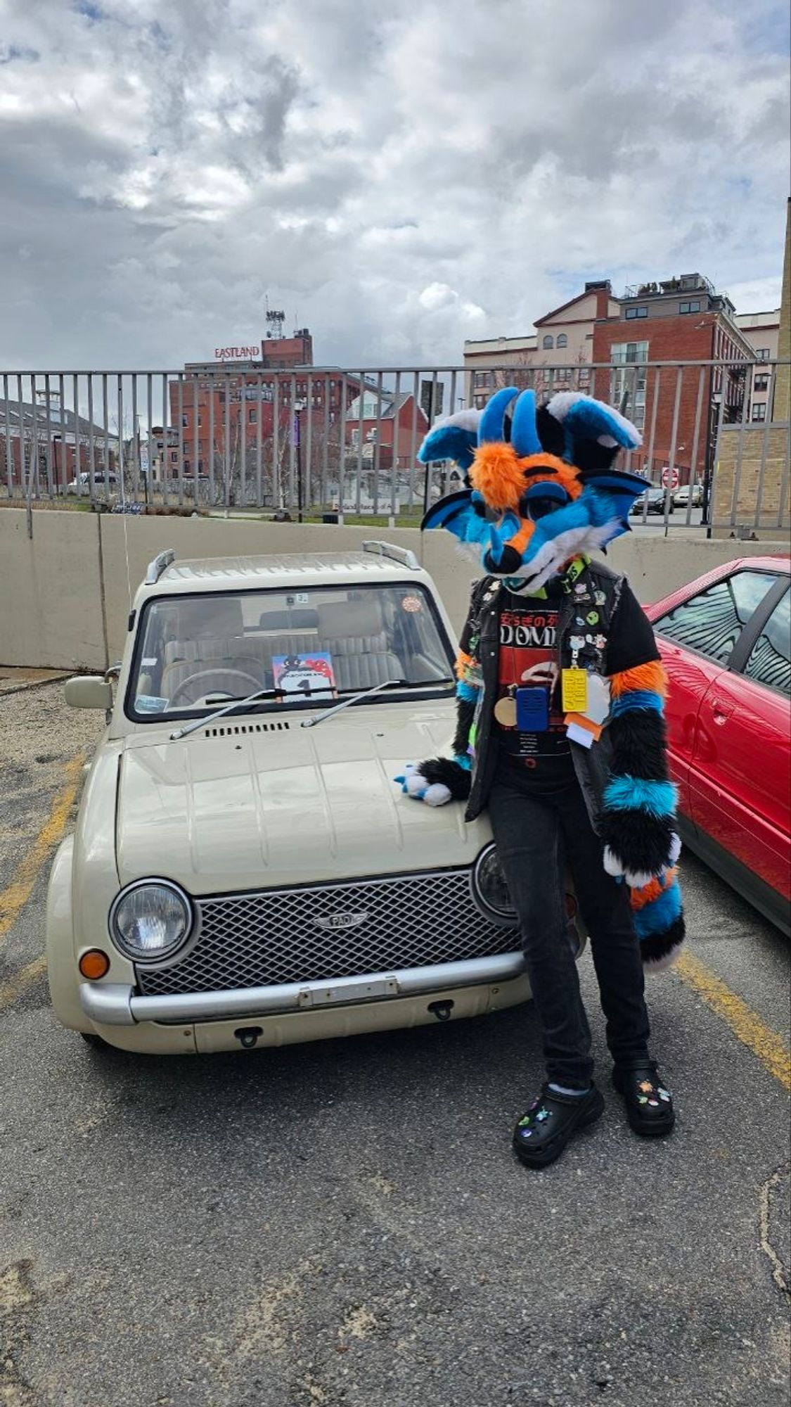 Casper posing next to the Nissan Pao