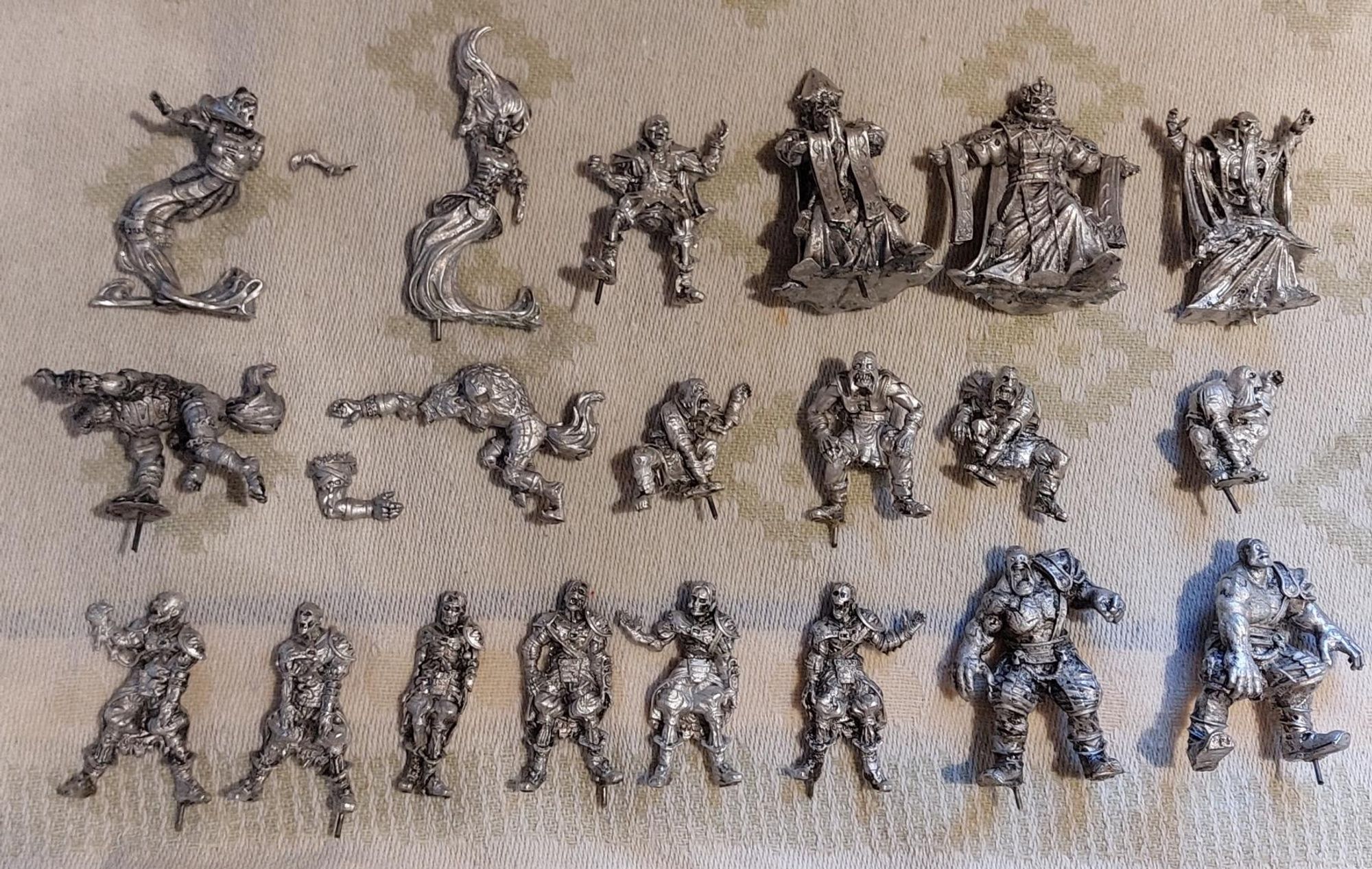 A mix of white metal ghouls, golems, mummies, werewolves, wraiths and a lone skellington. All still have traces of primer