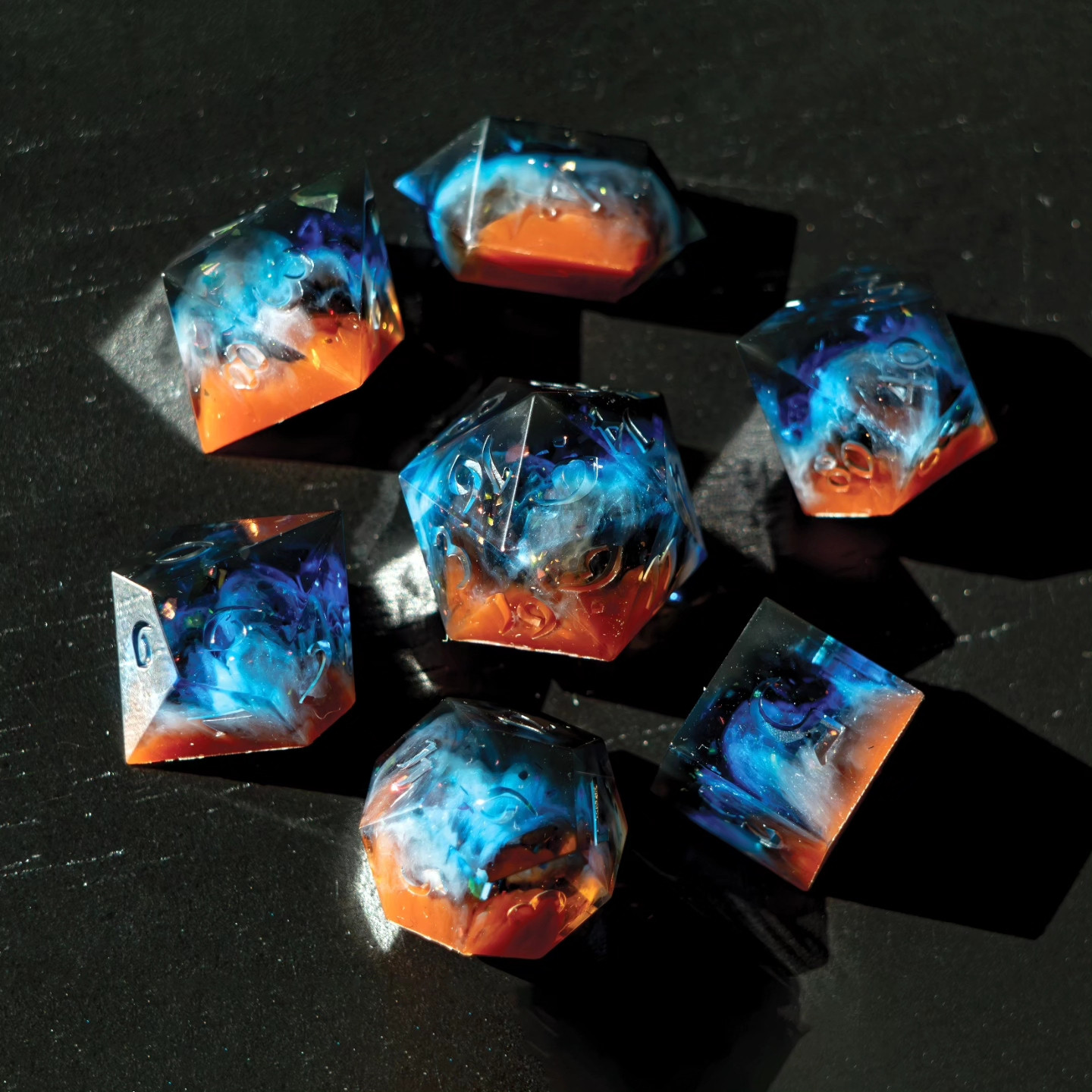 7 piece handmade dice set, unsanded, unpolished, and uninked. Made to look like the Cosmic cliffs.