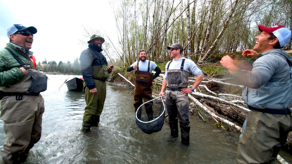 Fishermen proudly gloating over the size of their waders...