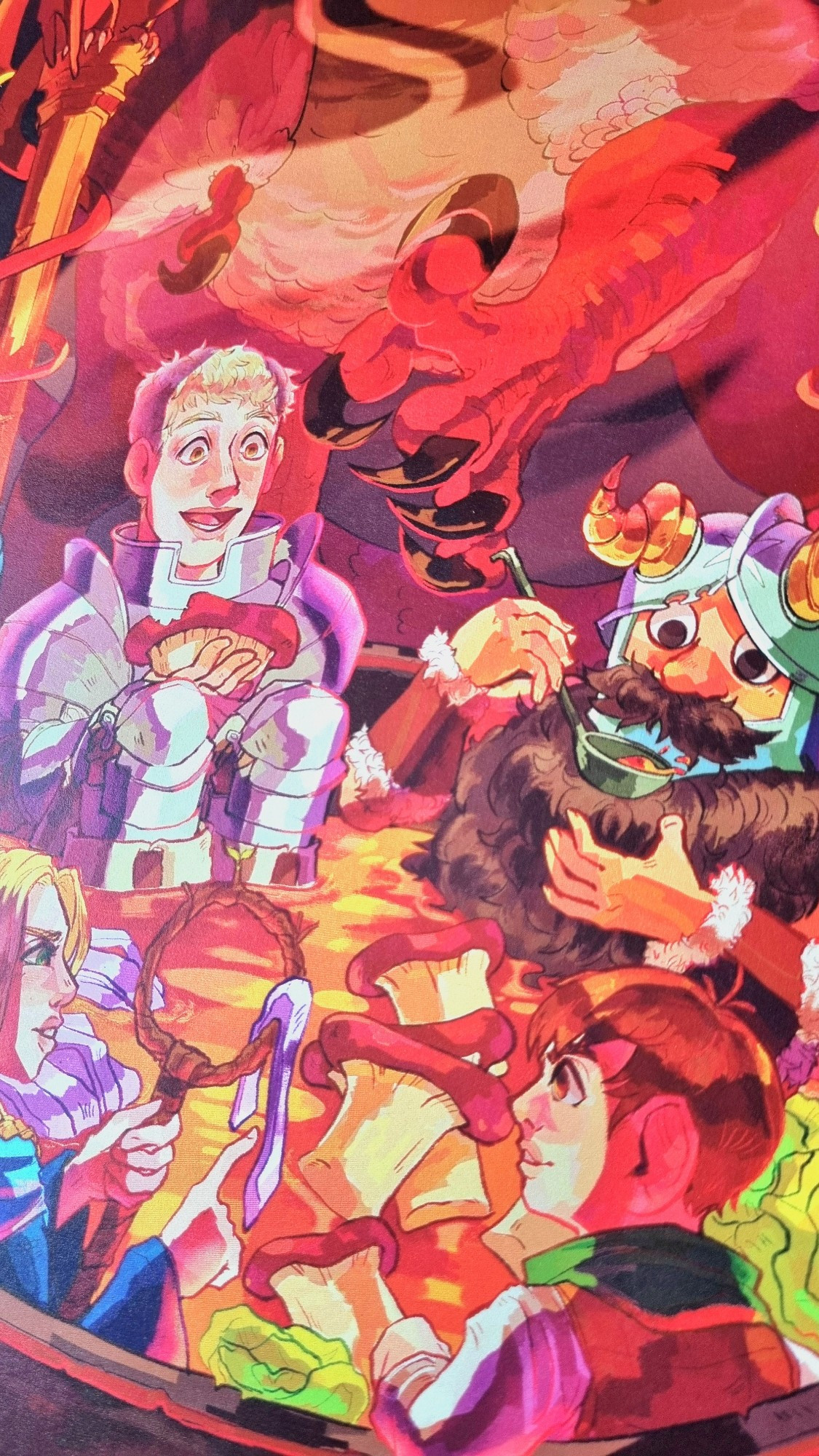 A closeup of an illustrated Dungeon Meshi print, showing the main cast sitting in a giant hotpot bowl.