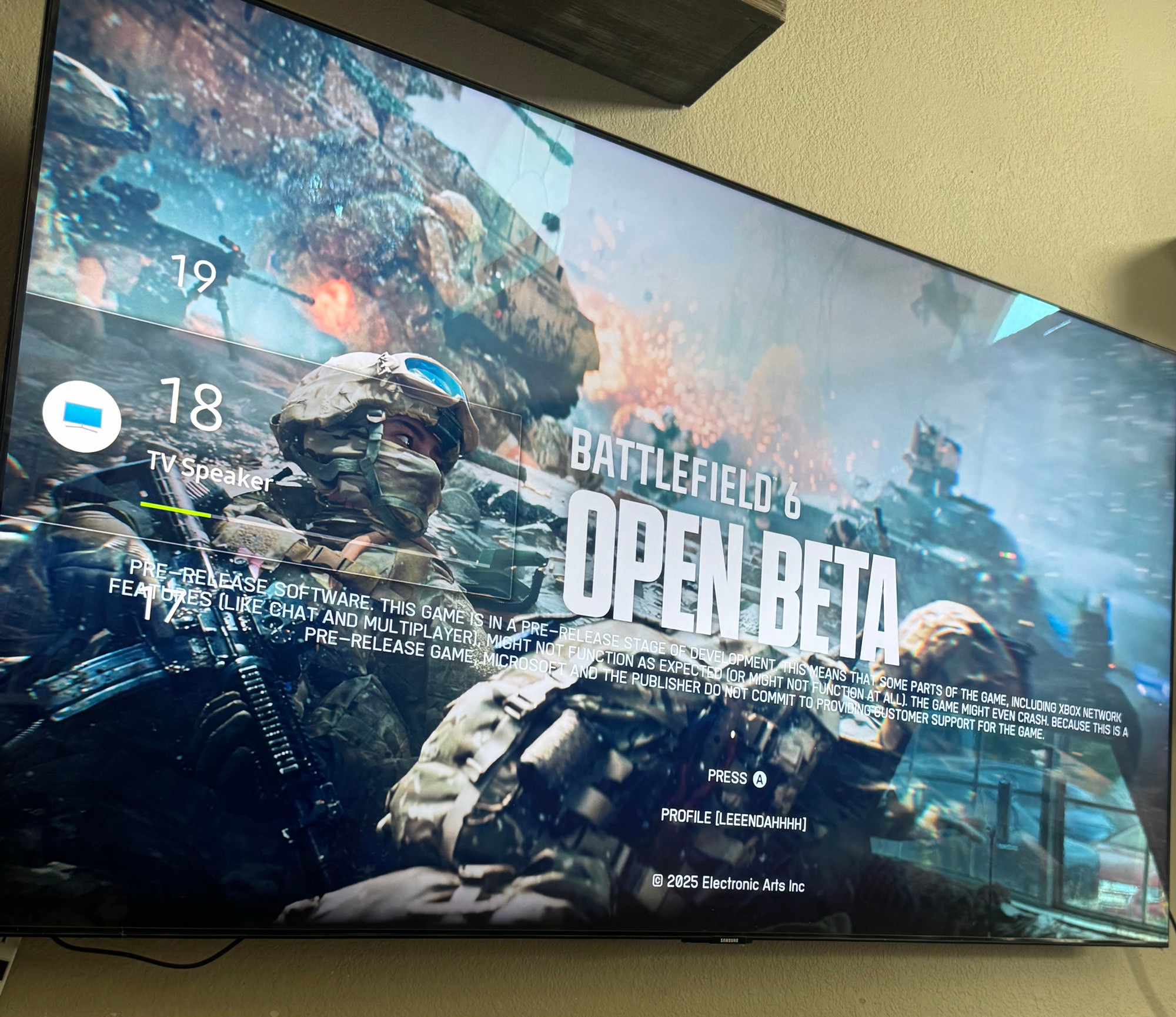 A picture of a TV screen showing the opening cover art for the Battlefield 6 Open Beta. 